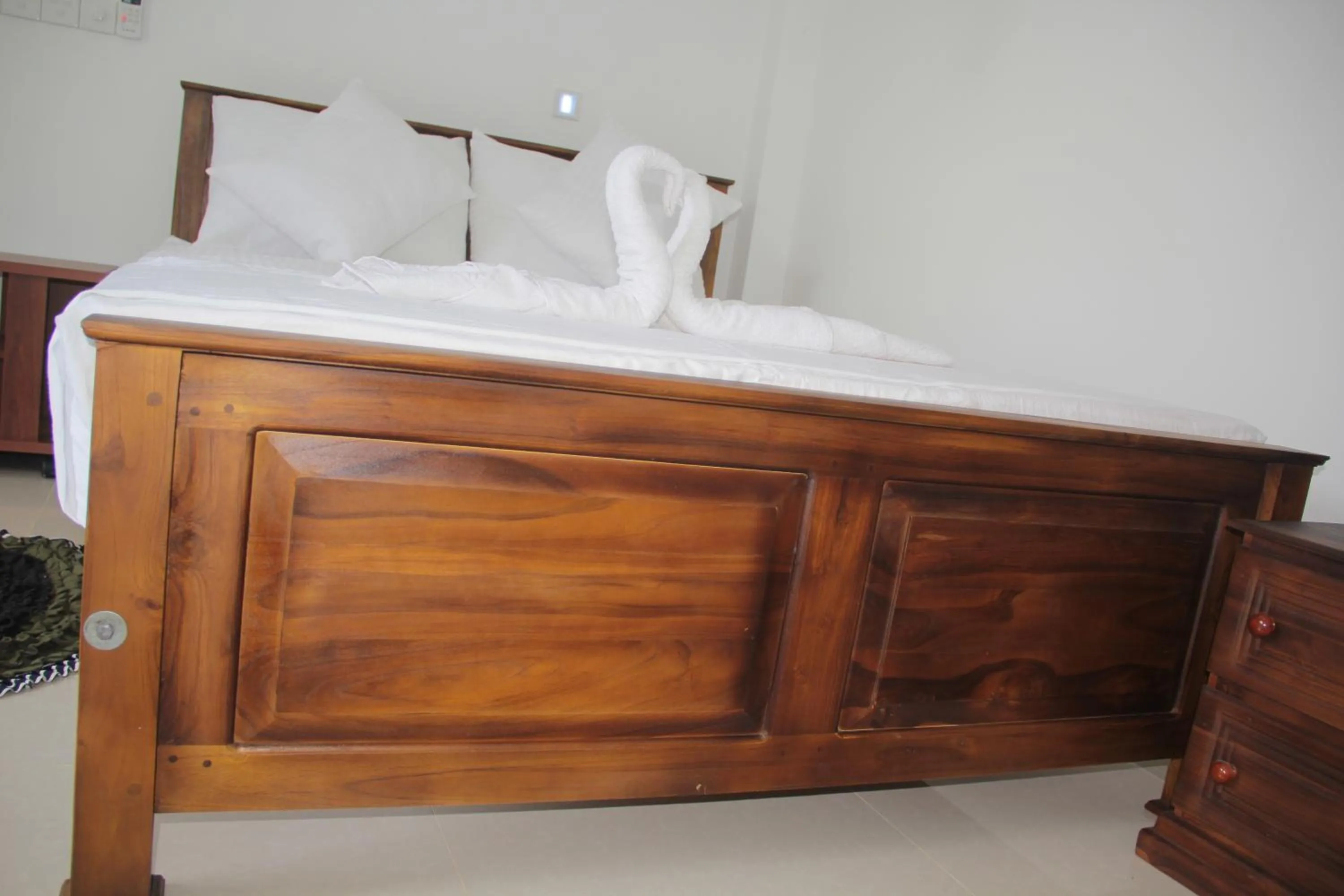 Bed in Butterfly Homestead Hotel