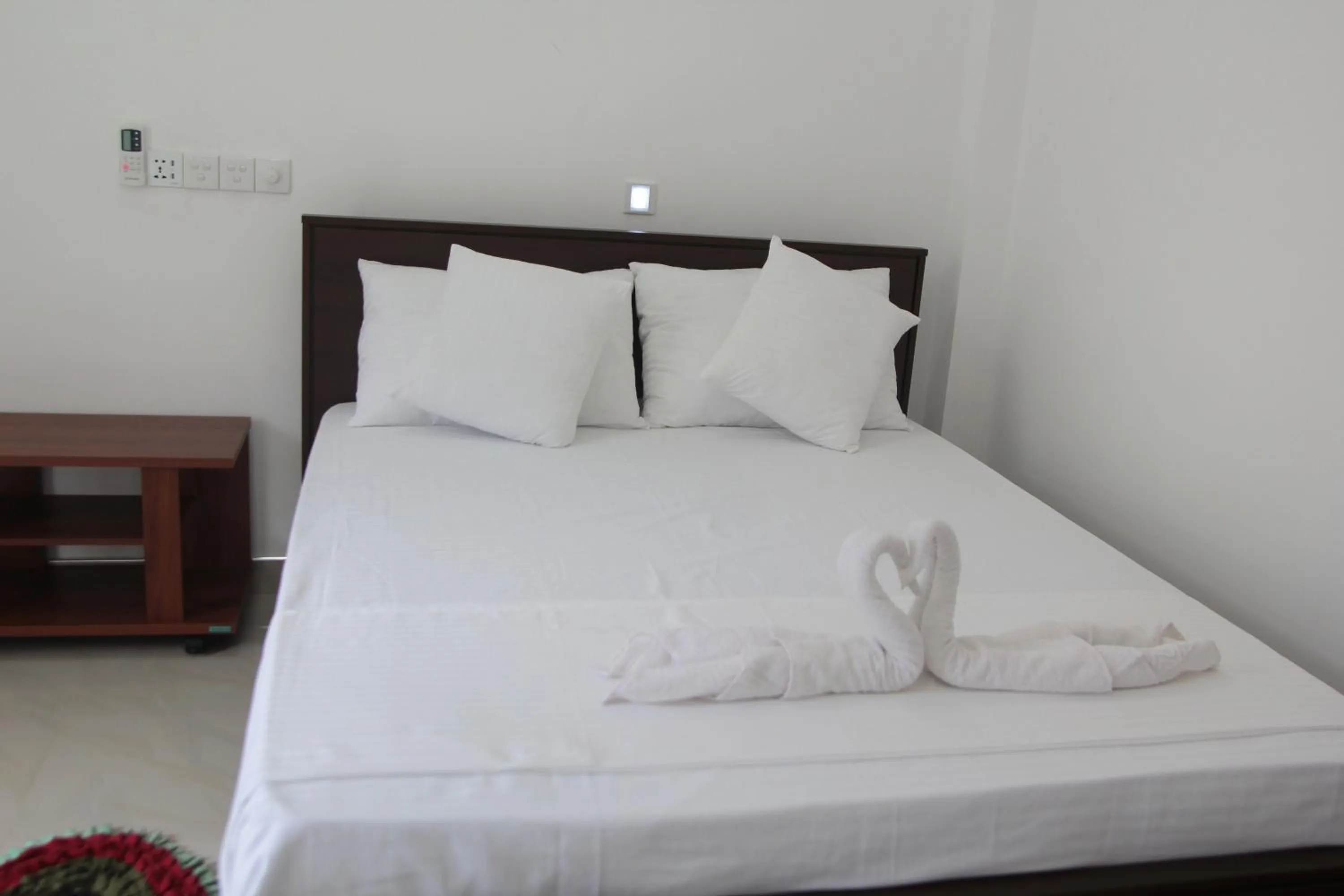 Bed in Butterfly Homestead Hotel