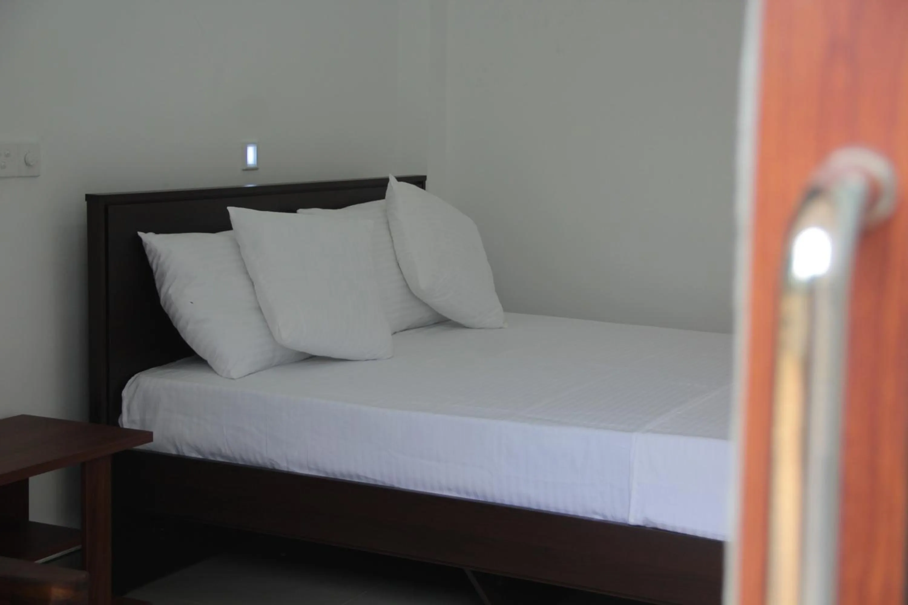 Bed in Butterfly Homestead Hotel