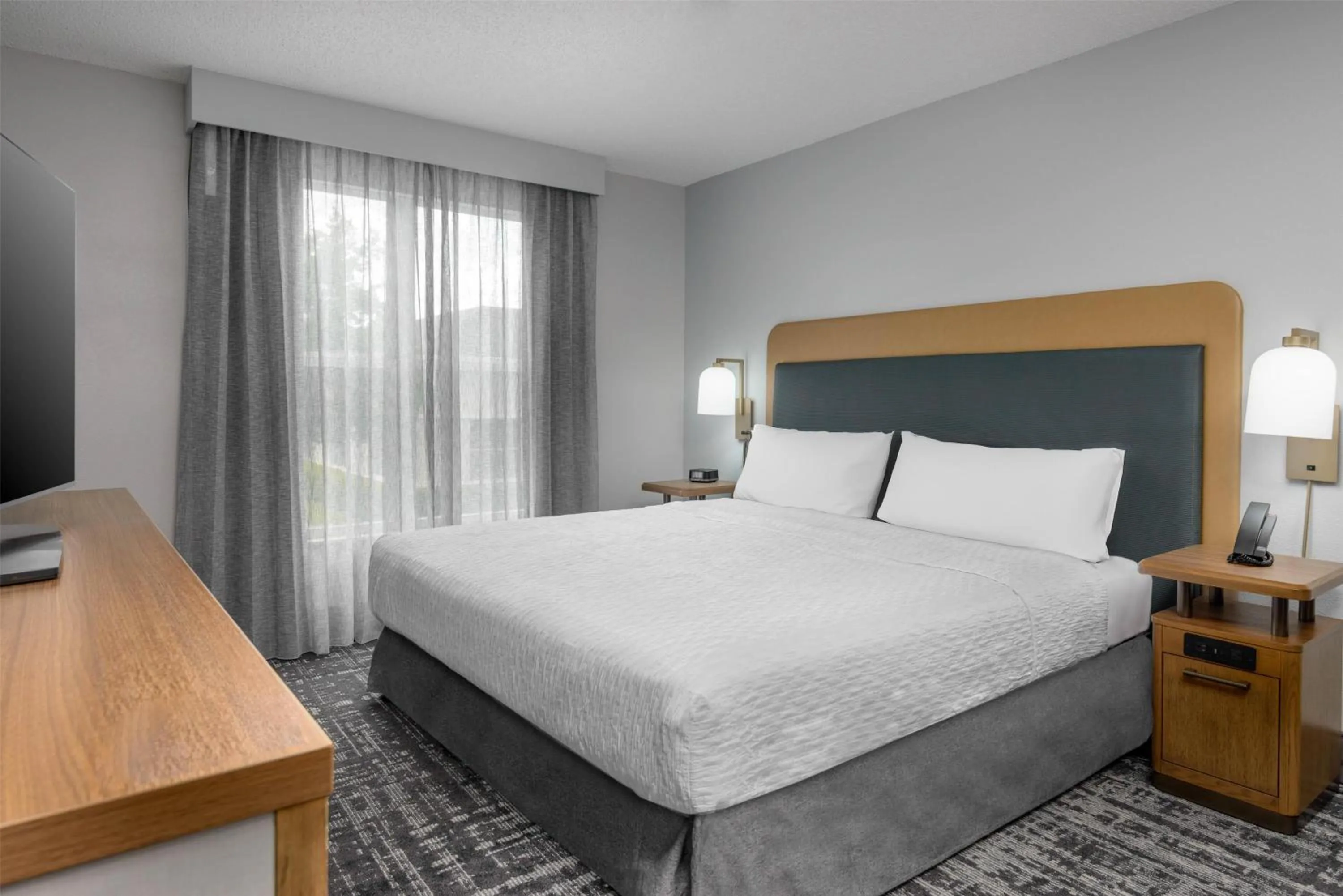 Bed in Homewood Suites by Hilton Orlando-UCF Area