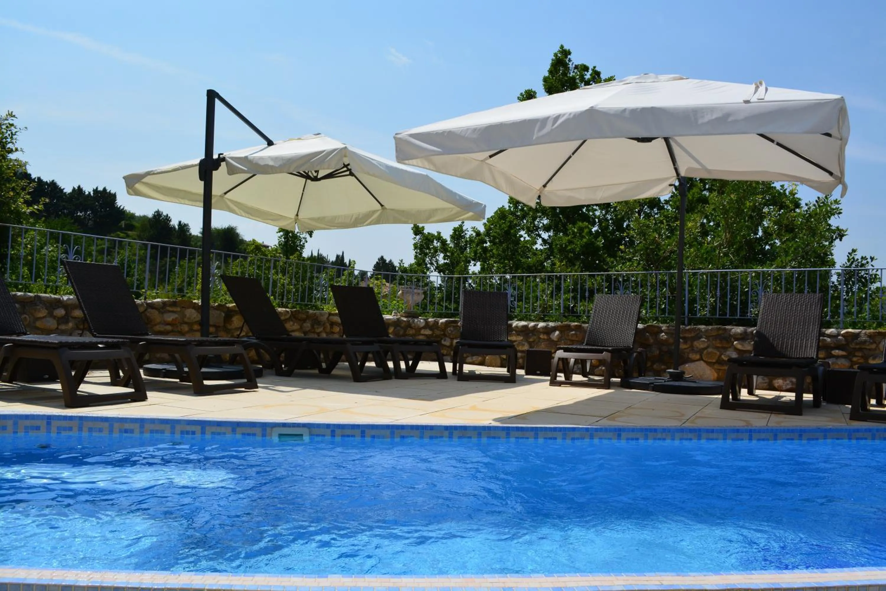 Swimming pool in Hôtel Le Colombier