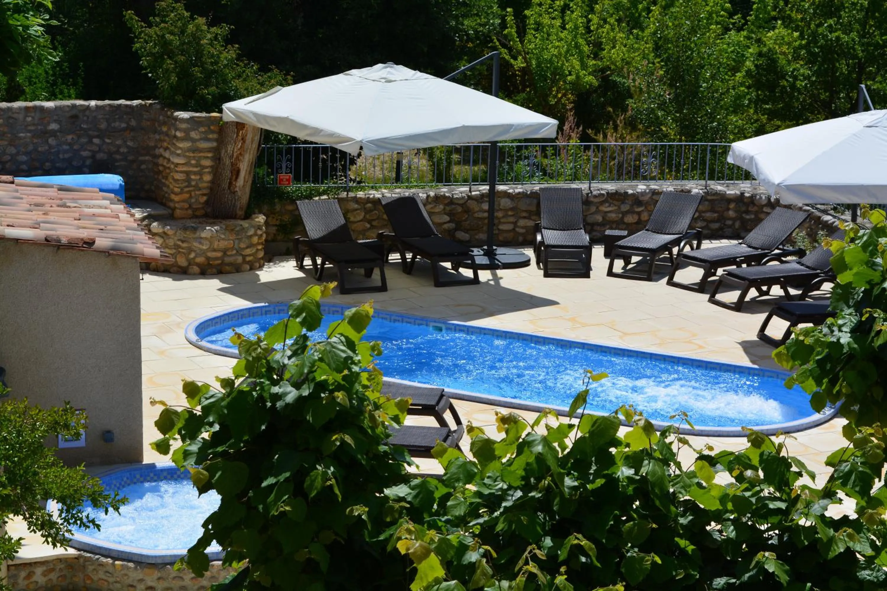 Swimming pool in Hôtel Le Colombier