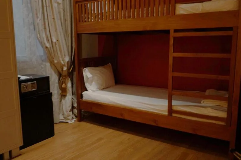 Bed in PEPO'S GUESTHOUSE