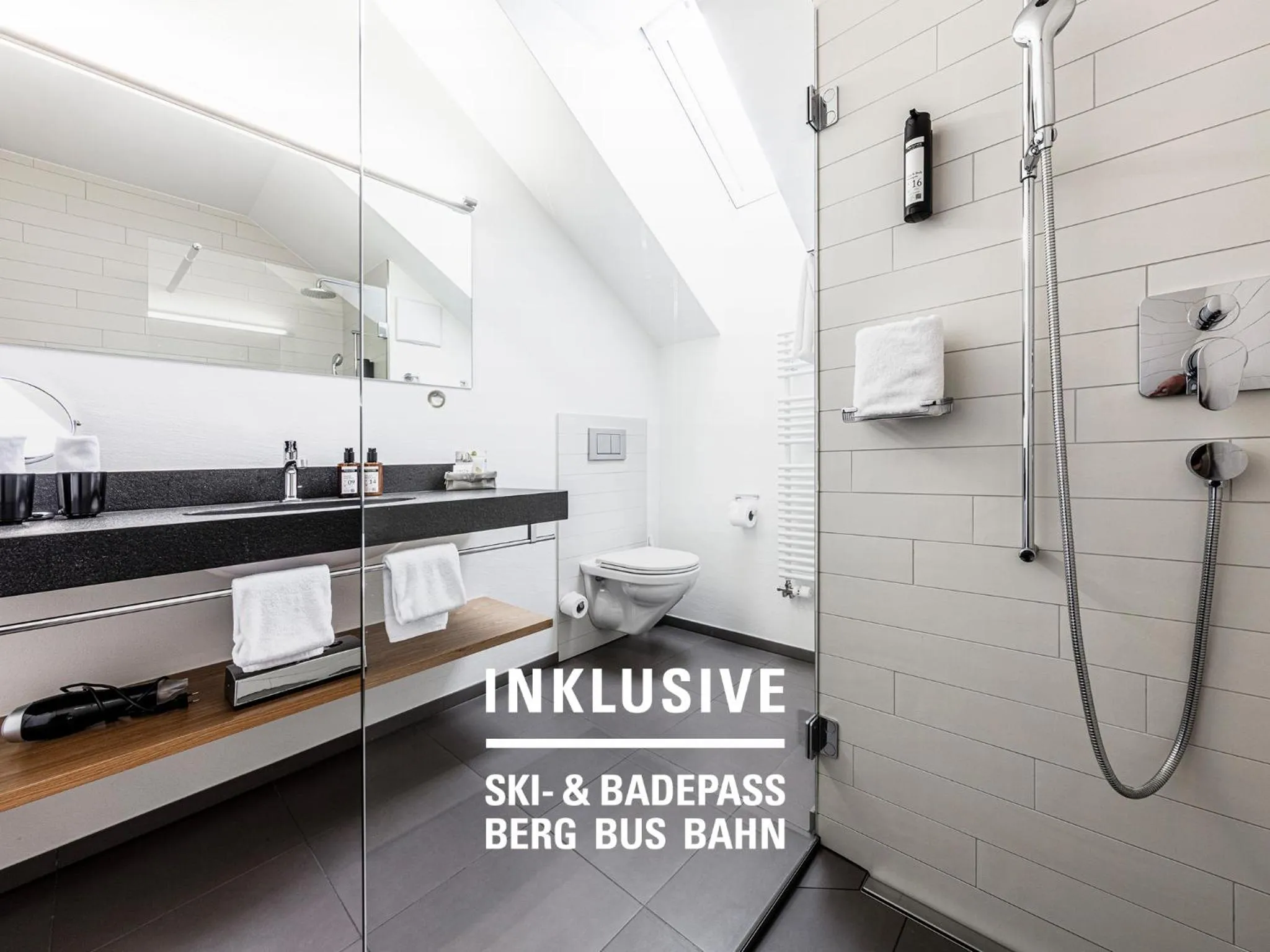 Shower in Engadiner Boutique-Hotel GuardaVal