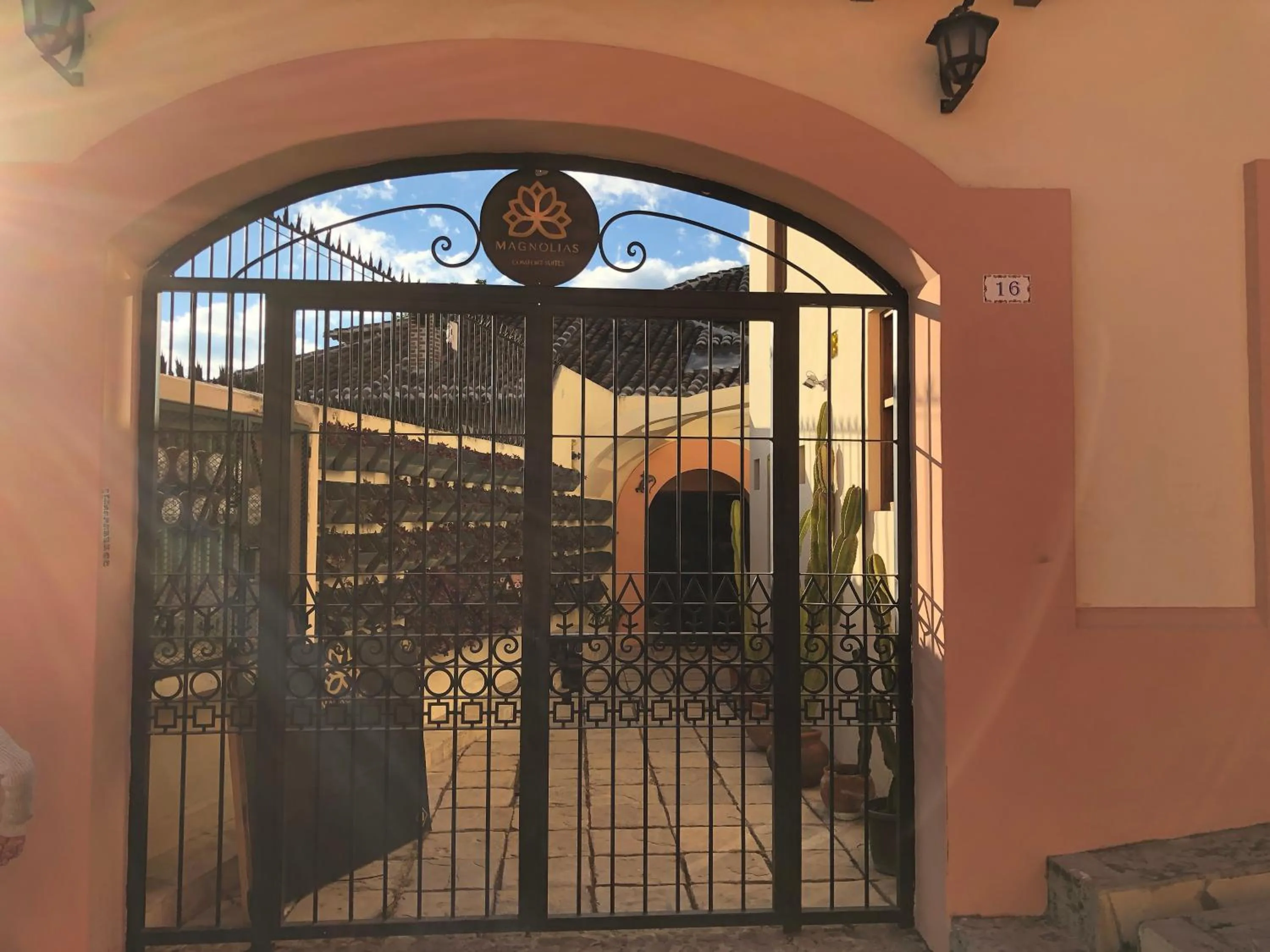 Property logo or sign in Magnolias Boutique Suites & SPA