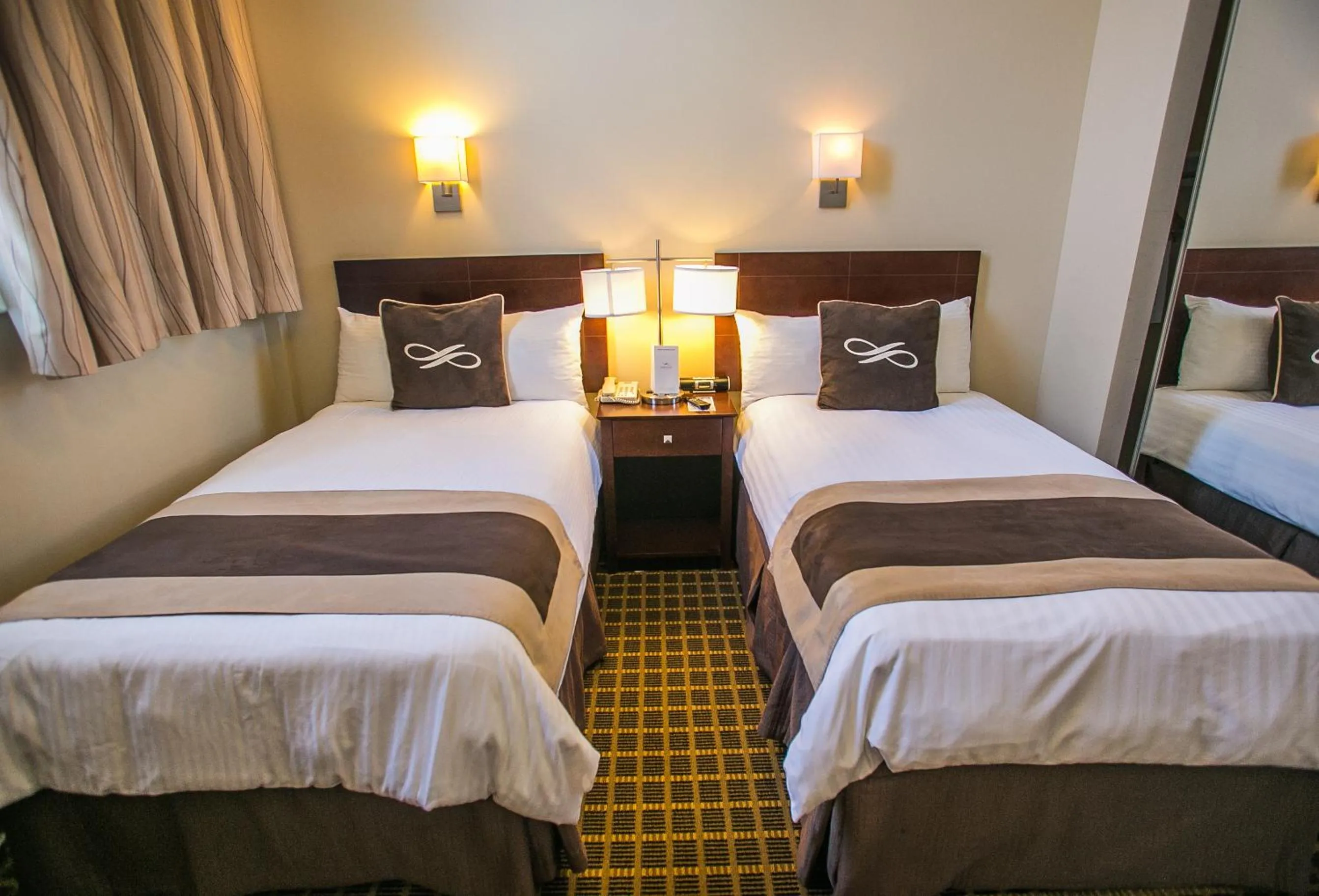 Bed in Pointe Plaza Hotel