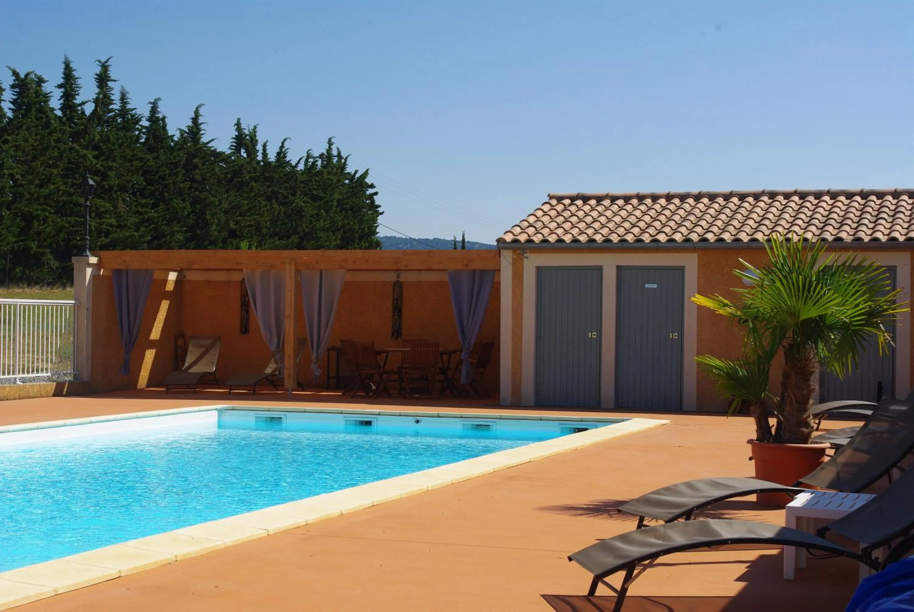 Swimming pool in Hôtel et Restaurant Logis Le Mas de Mon Père