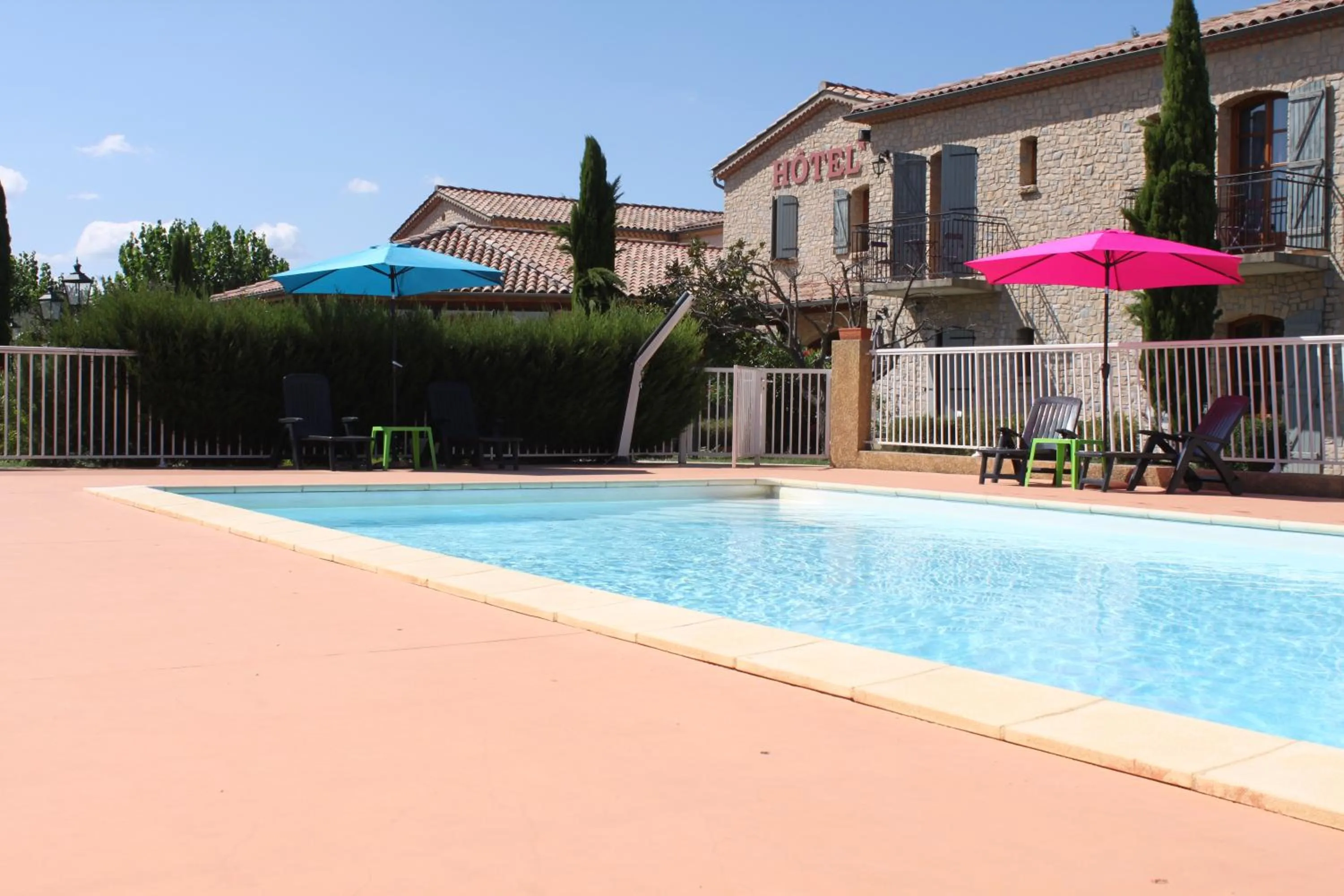 Swimming pool in Hôtel et Restaurant Logis Le Mas de Mon Père