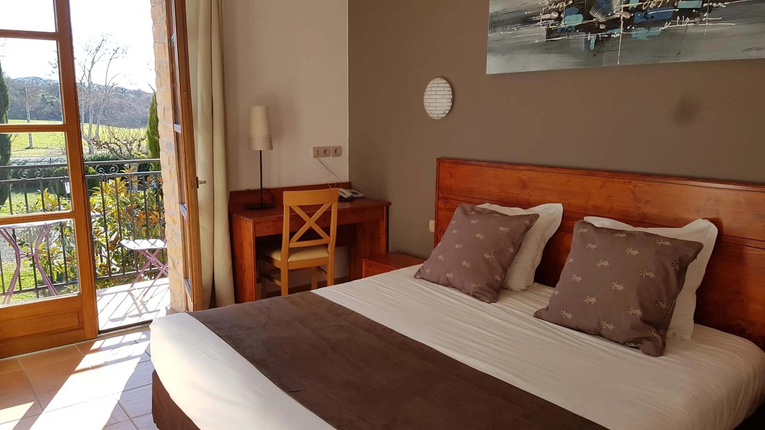 Balcony/Terrace, Bed in Hôtel et Restaurant Logis Le Mas de Mon Père