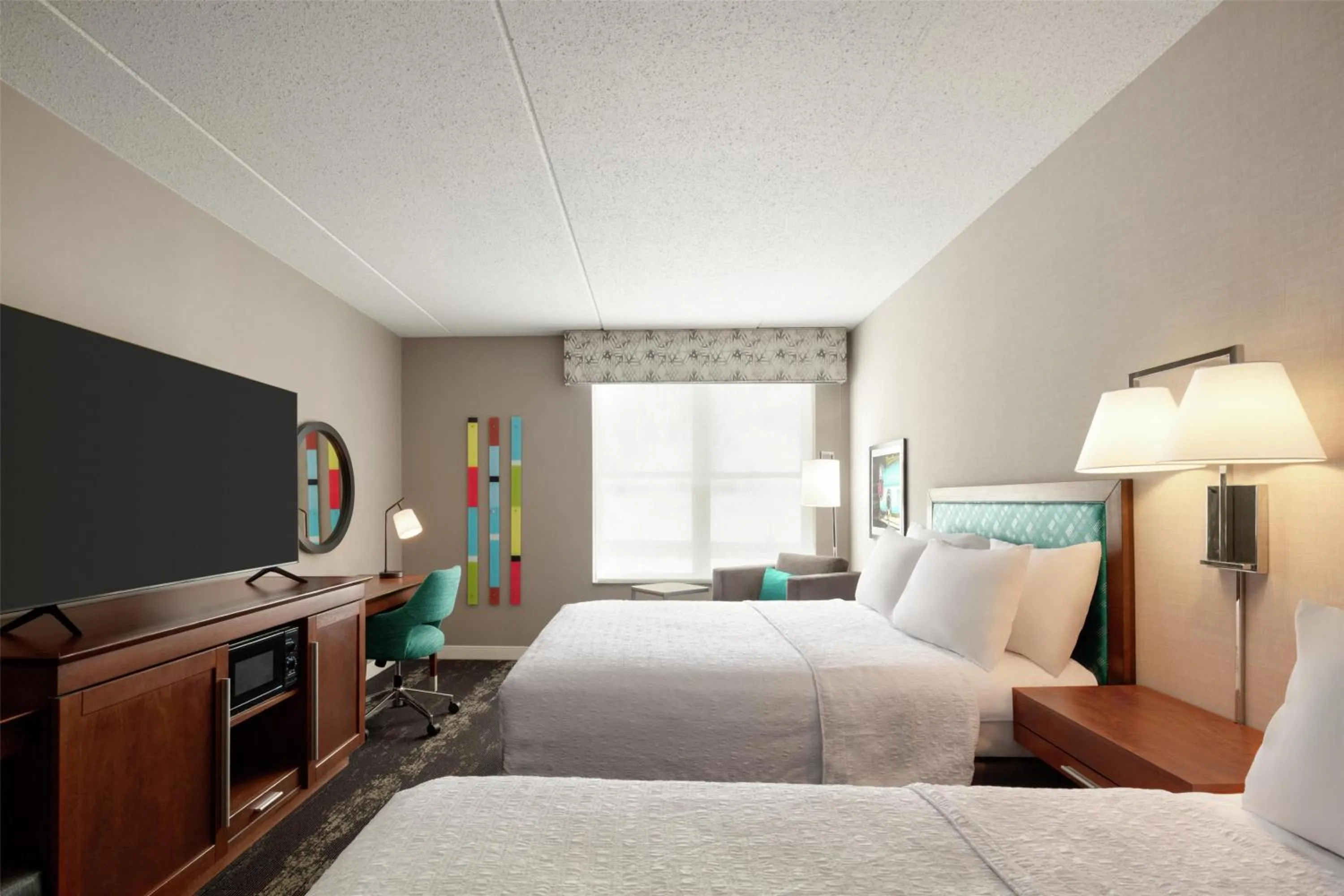 Bed in Hampton Inn at Tin Lizzie Gaming Resort