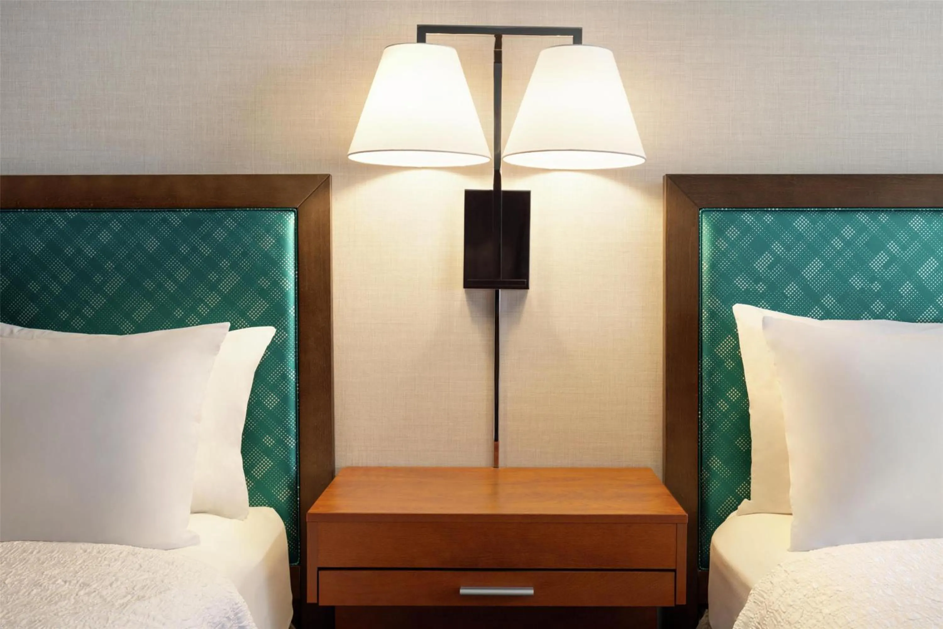 Bed in Hampton Inn at Tin Lizzie Gaming Resort