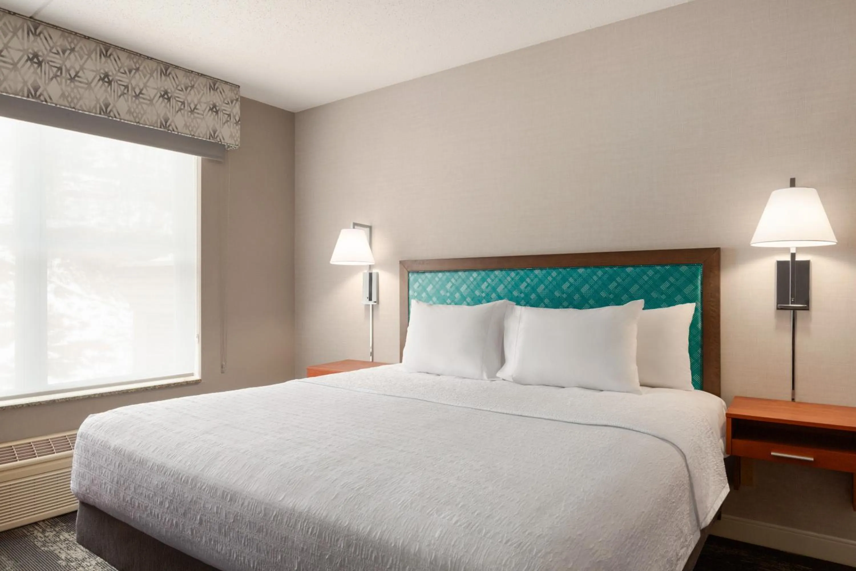 Bed in Hampton Inn at Tin Lizzie Gaming Resort