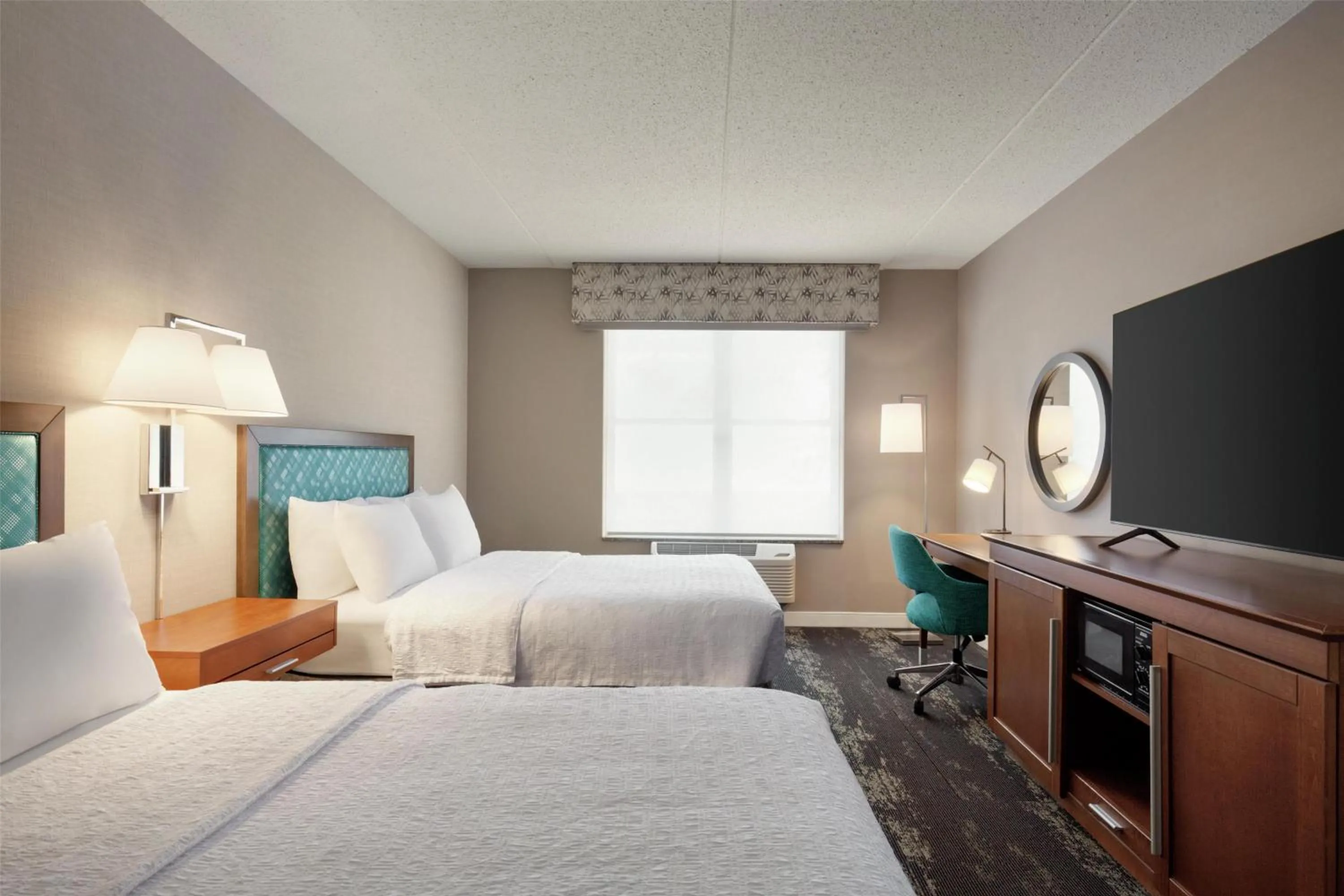 Bed in Hampton Inn at Tin Lizzie Gaming Resort