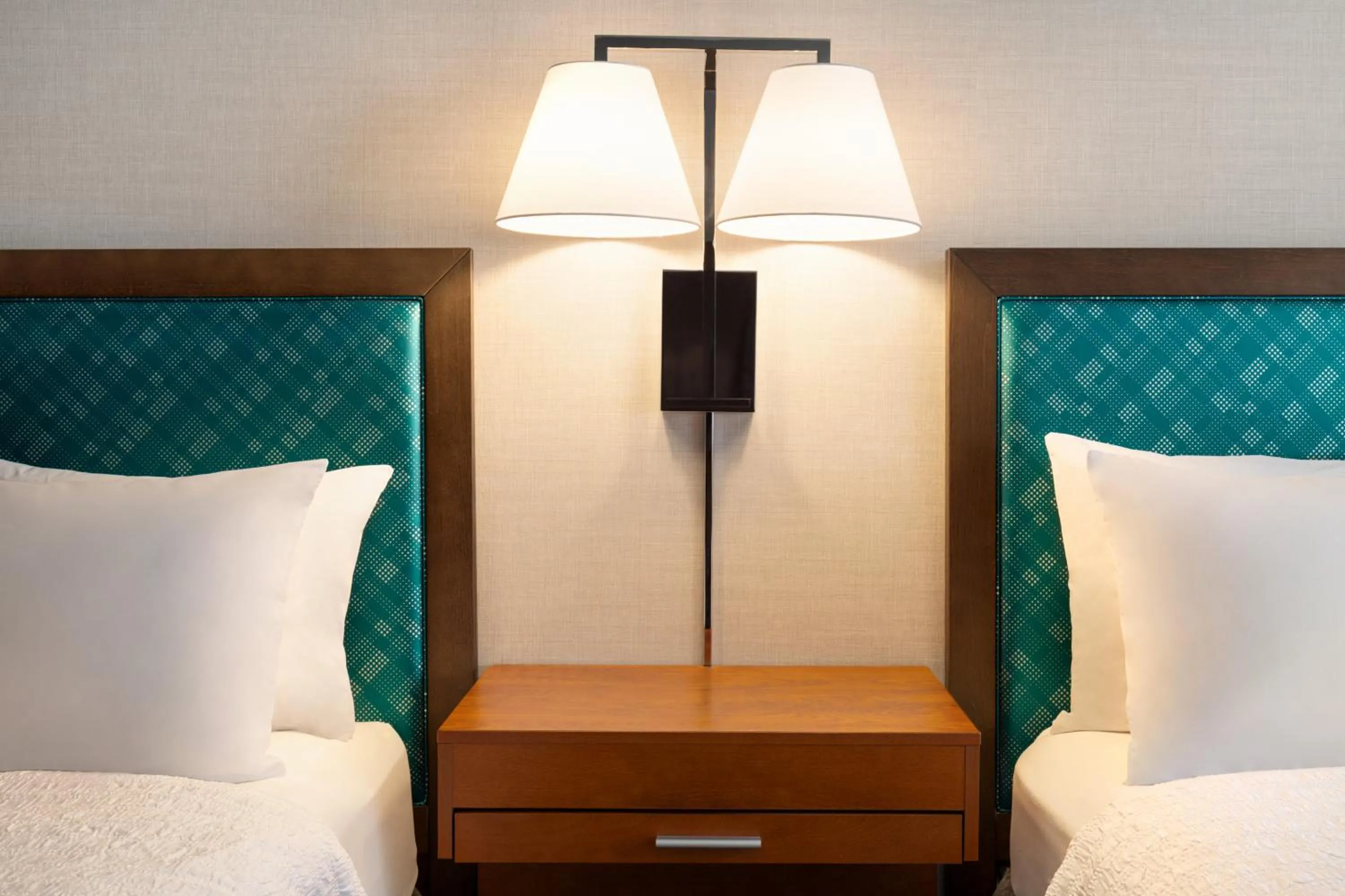 Bed in Hampton Inn at Tin Lizzie Gaming Resort