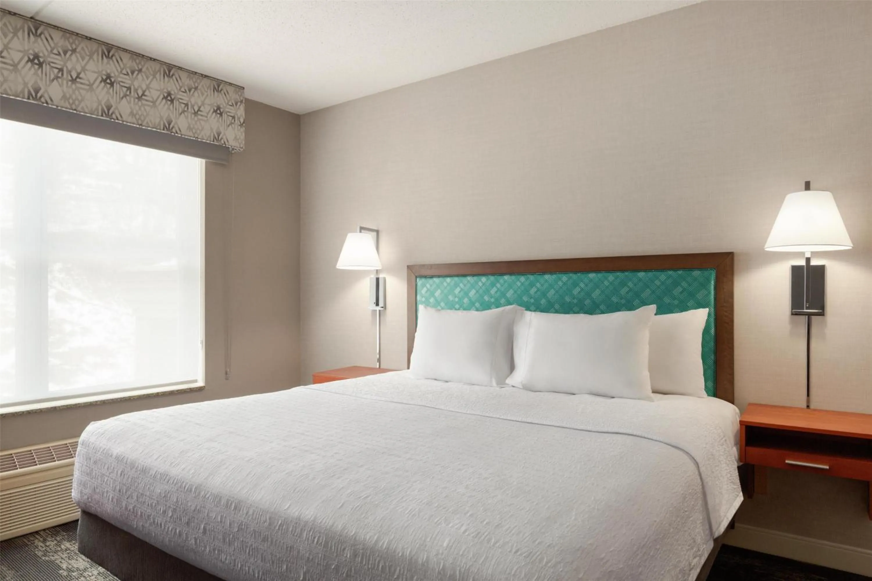 Bed in Hampton Inn at Tin Lizzie Gaming Resort