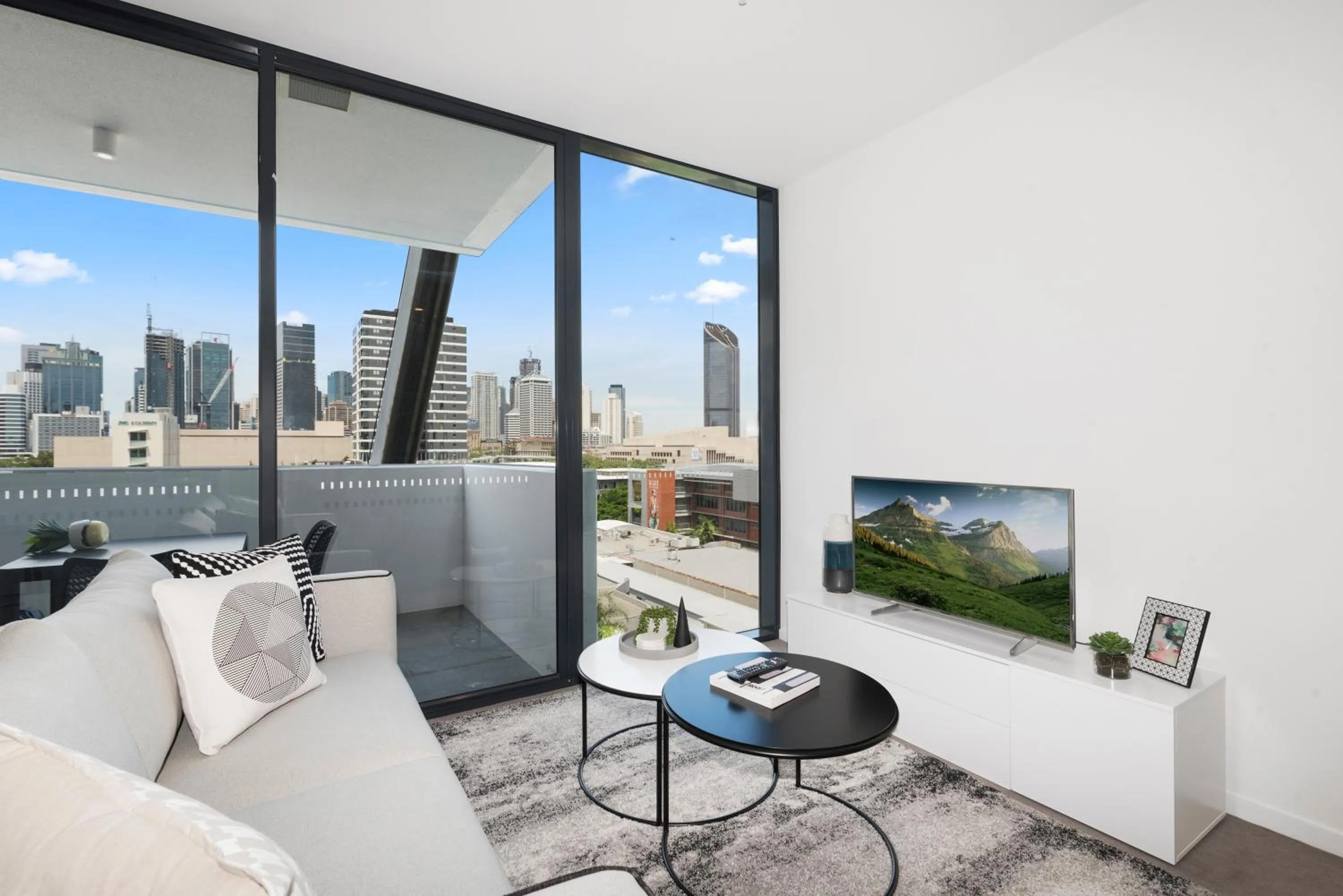 TV and multimedia in Ivy and Eve Apartments by CLLIX