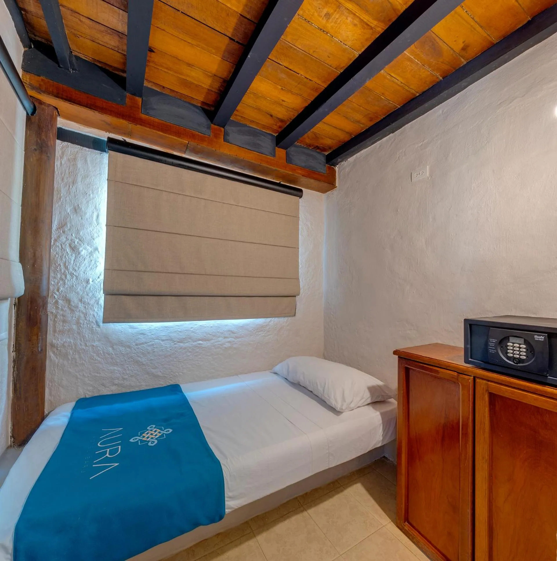 Bed in Aura Hotel Barú