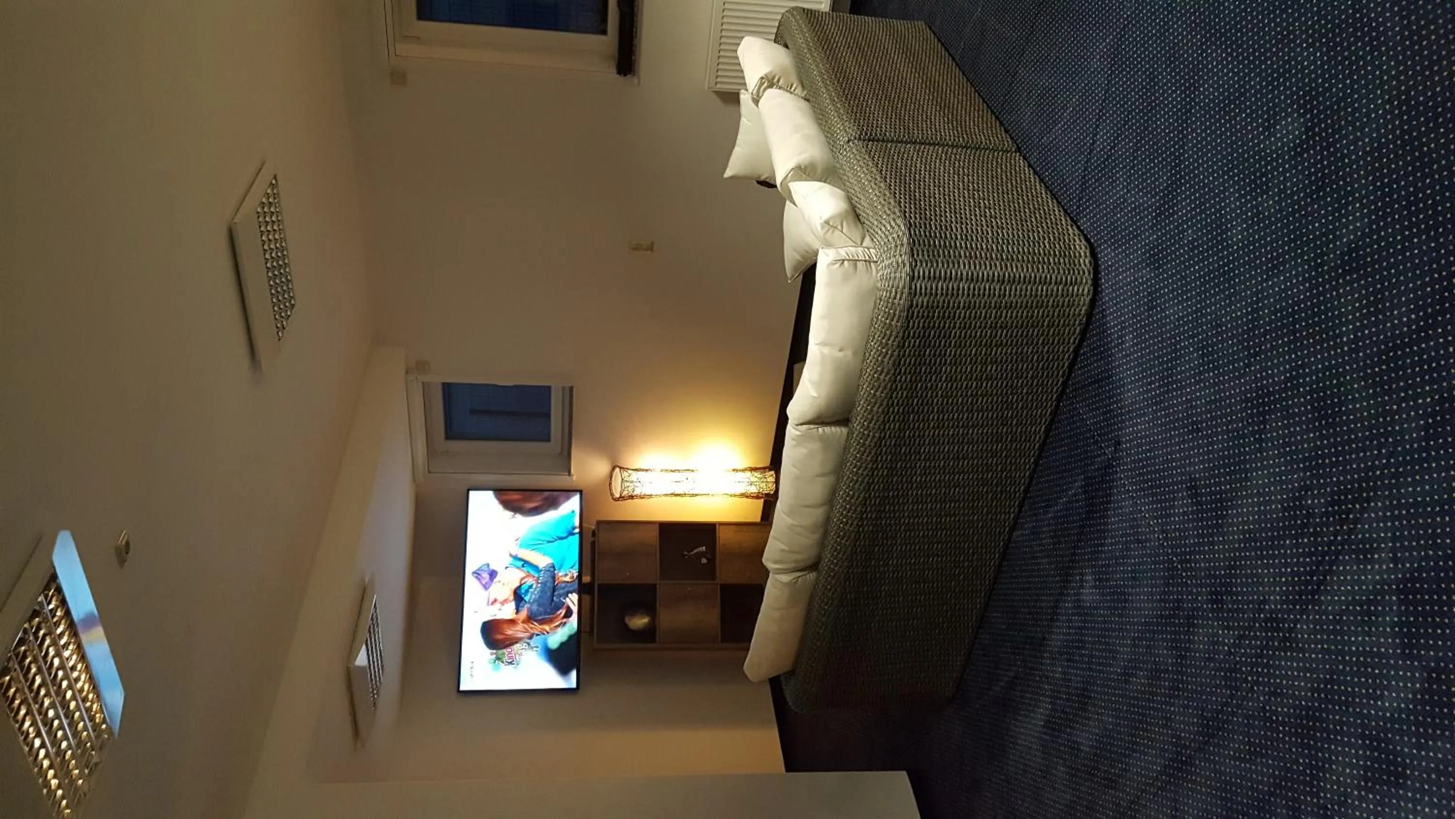 Communal lounge/ TV room, Bed in Hotel Beuss