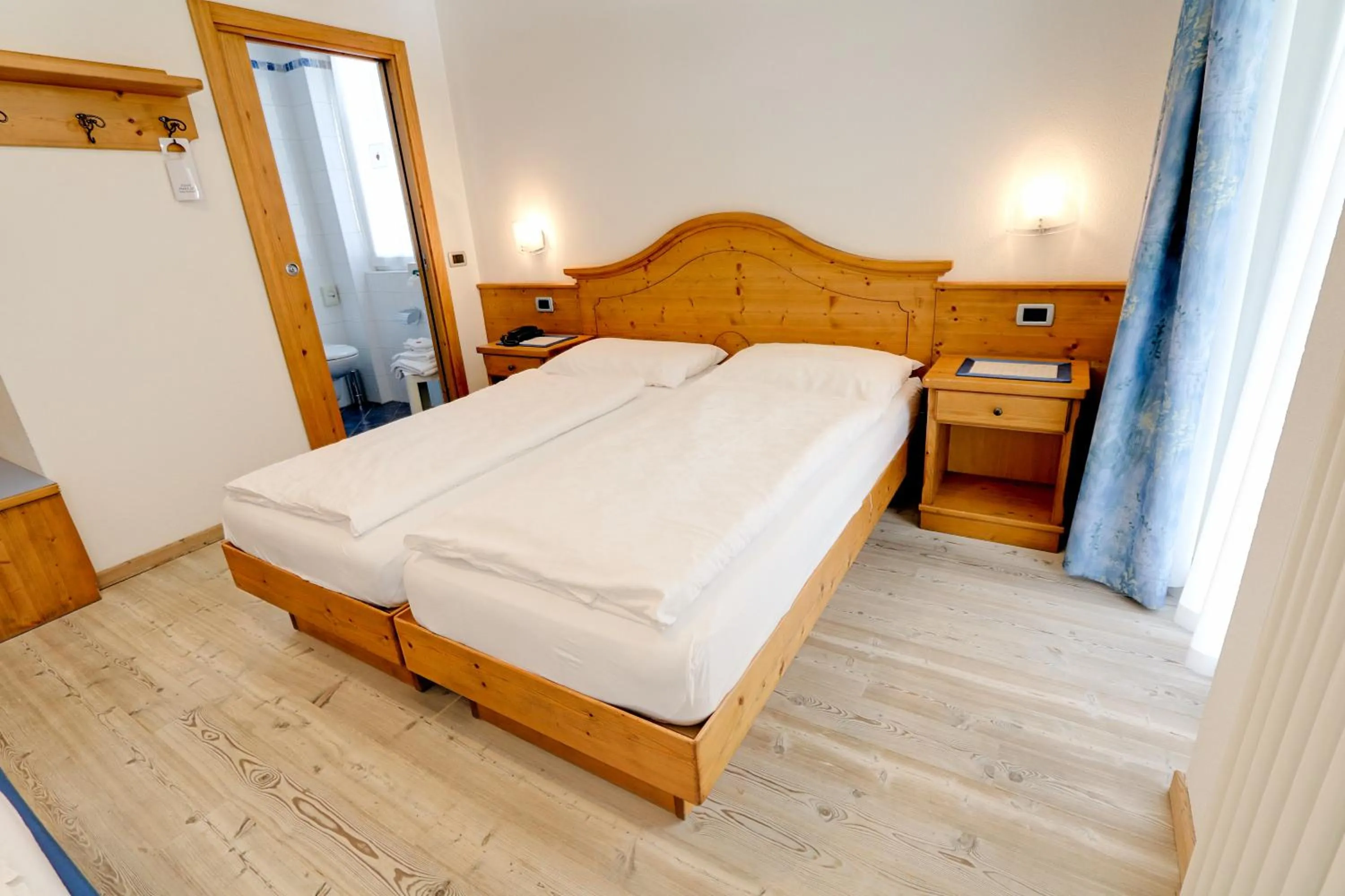 Bed in Hotel Garni Sottobosco