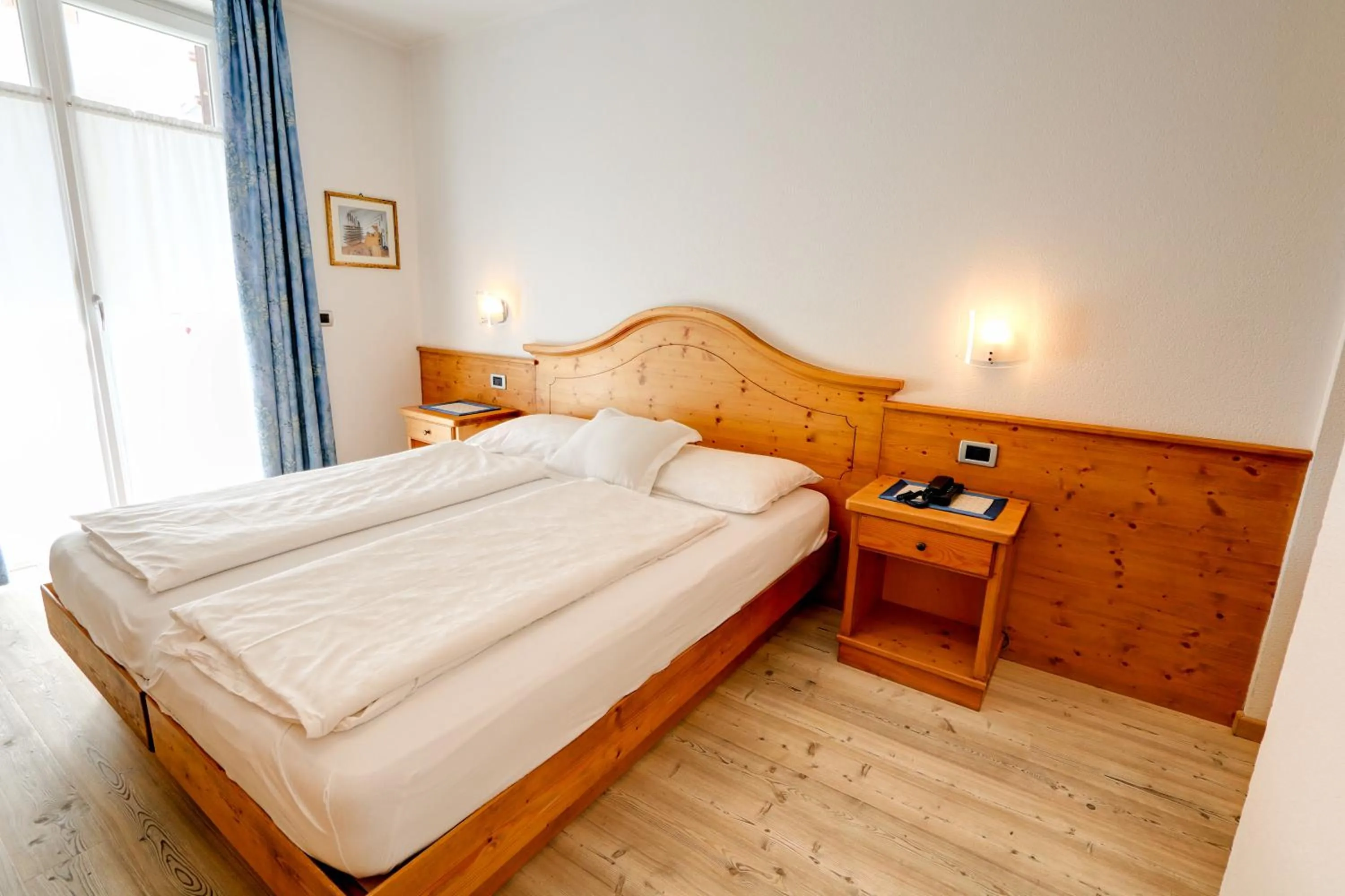 Bed in Hotel Garni Sottobosco