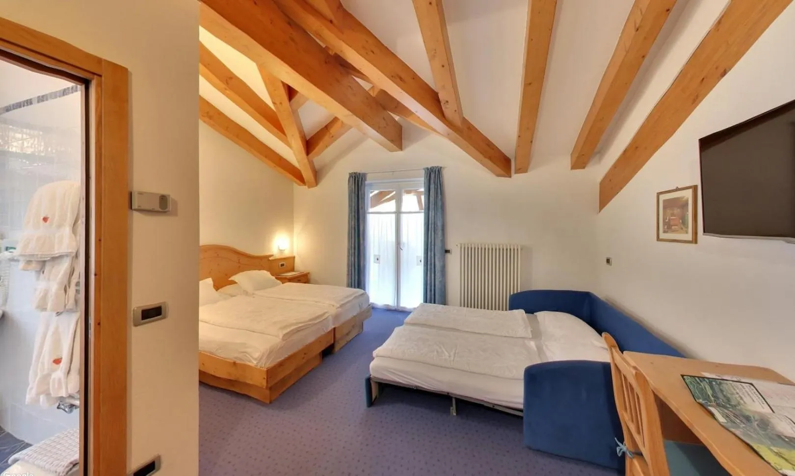 Bed in Hotel Garni Sottobosco