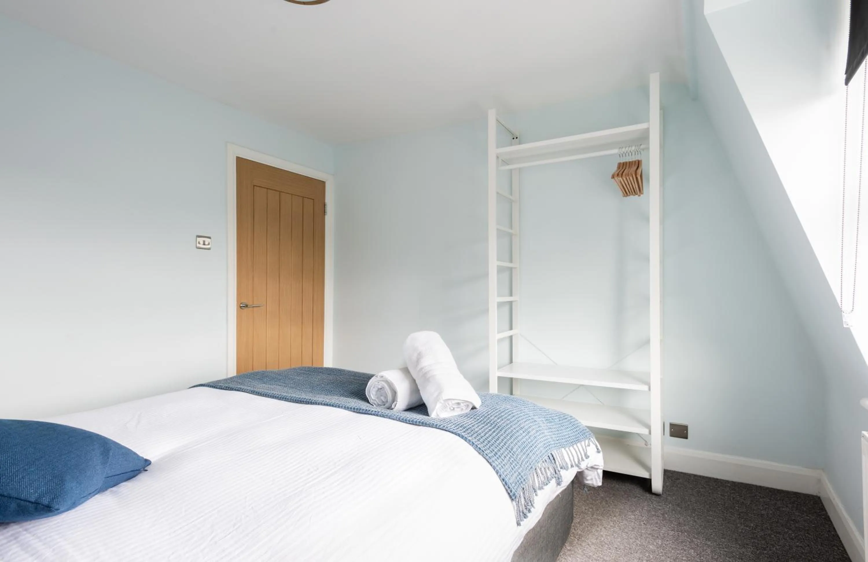 Bed in The Love Walk Apartments