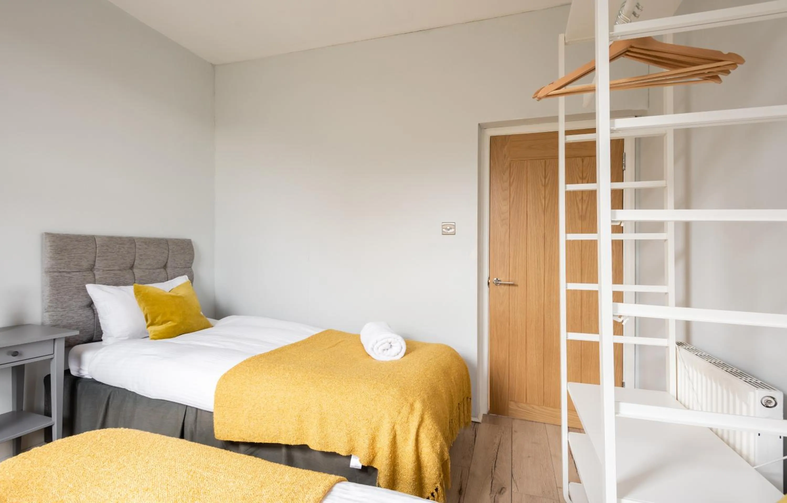 Bed in The Love Walk Apartments