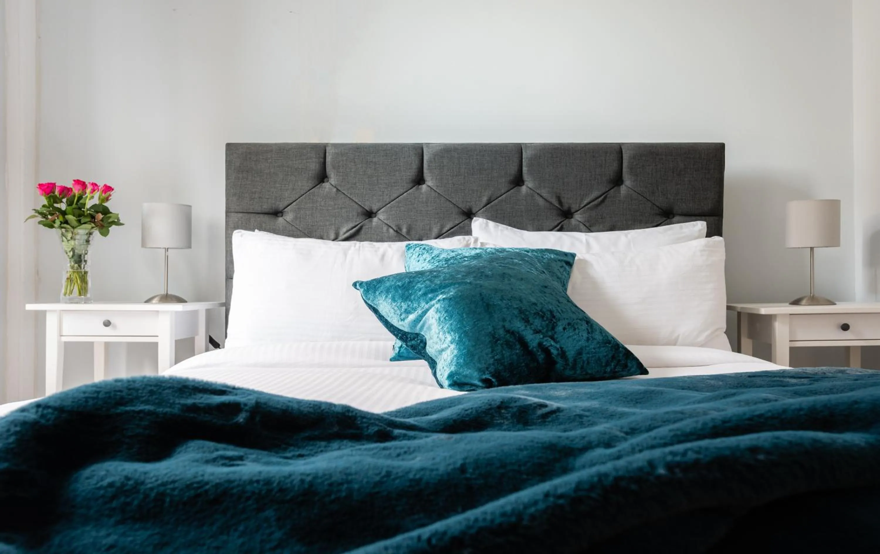 Bed in The Love Walk Apartments