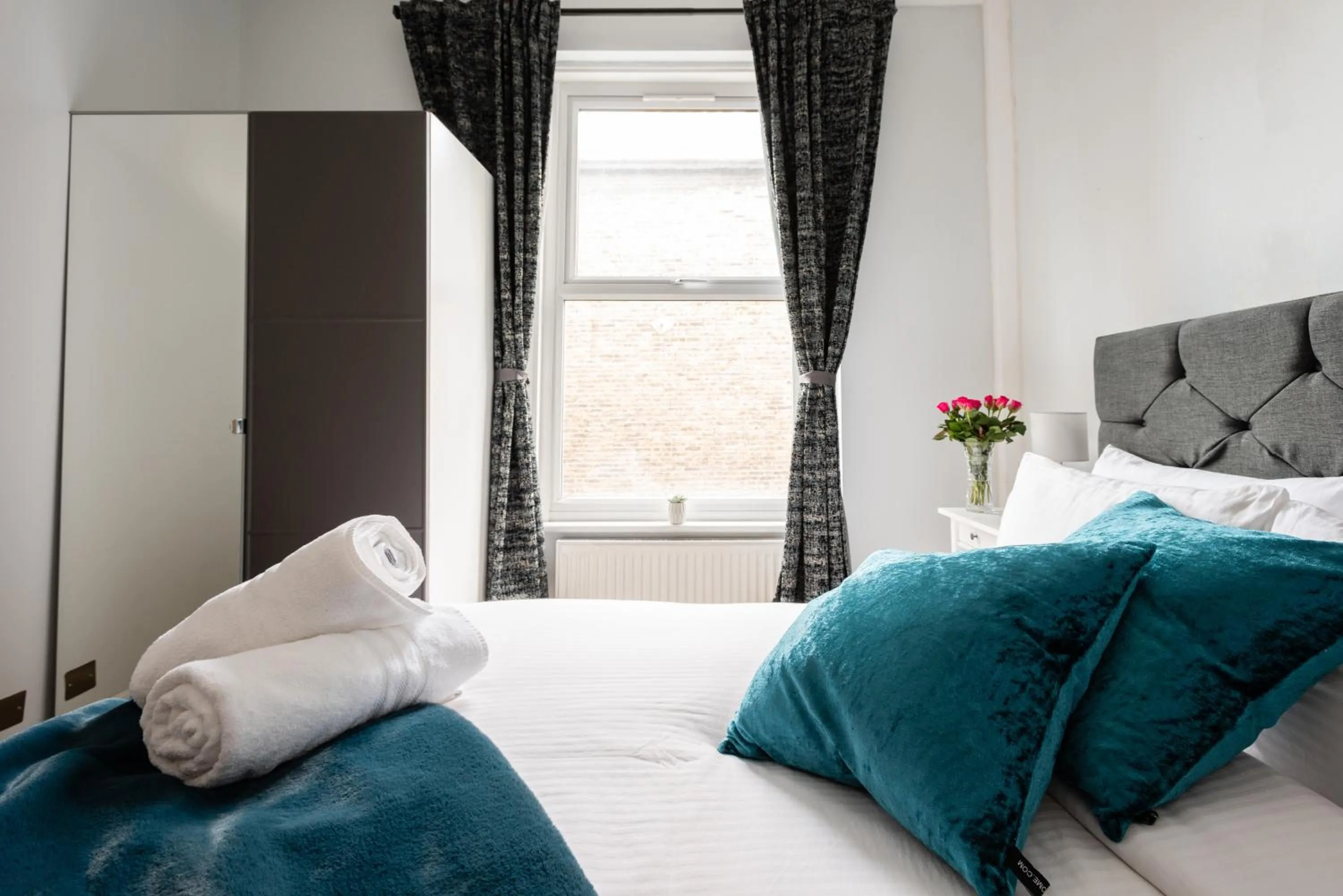 Bed in The Love Walk Apartments