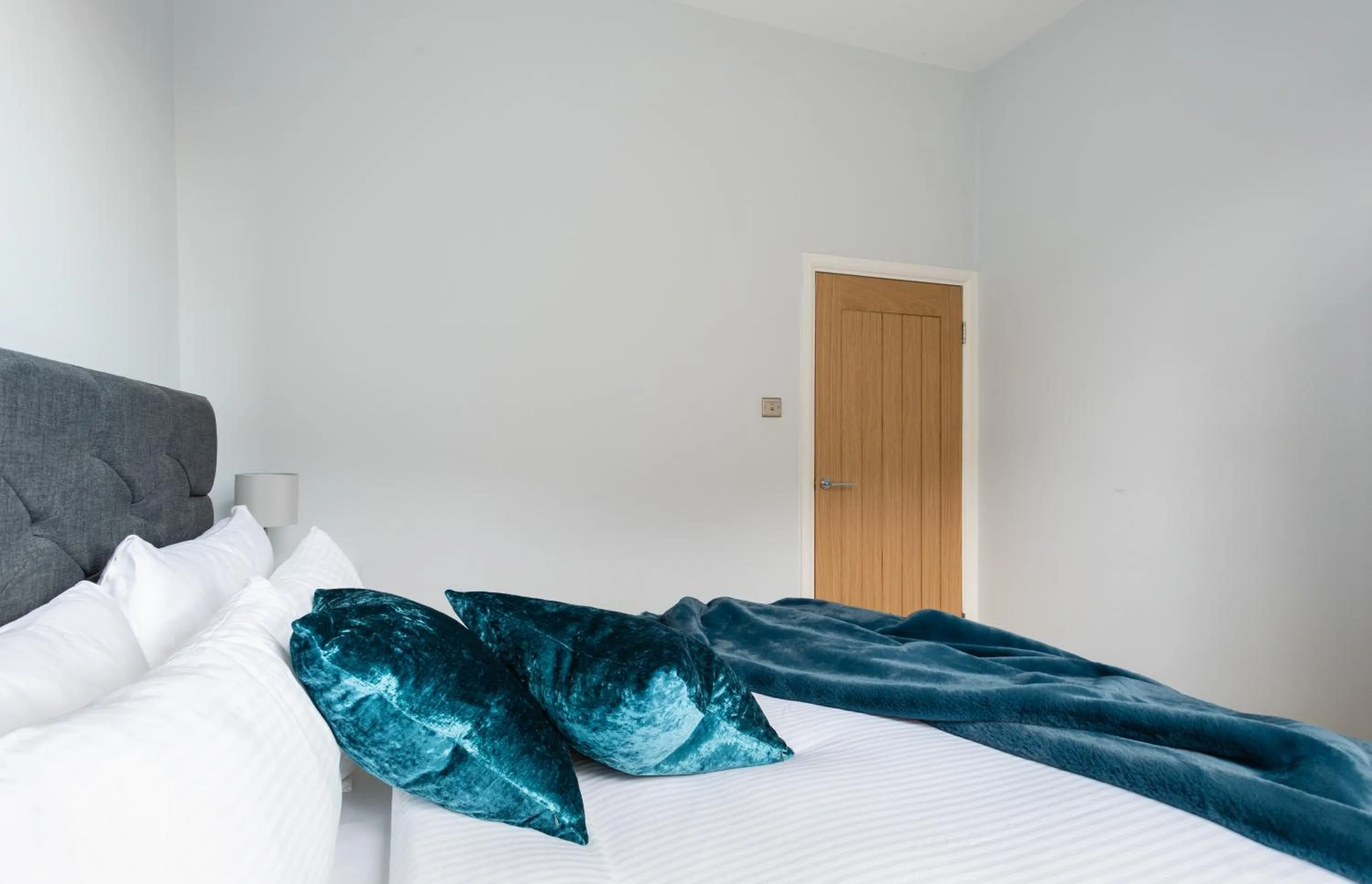 Bed in The Love Walk Apartments