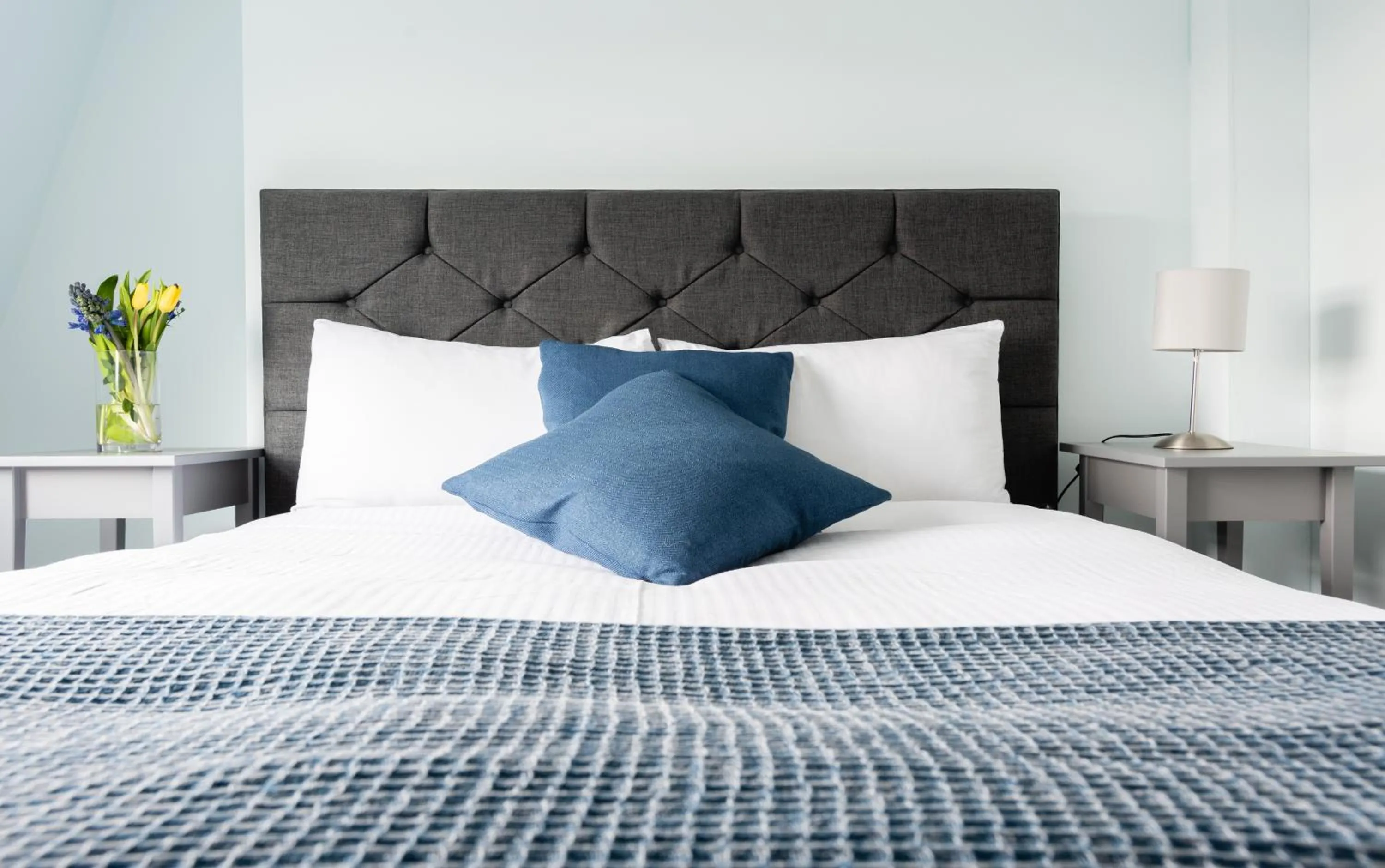 Bed in The Love Walk Apartments