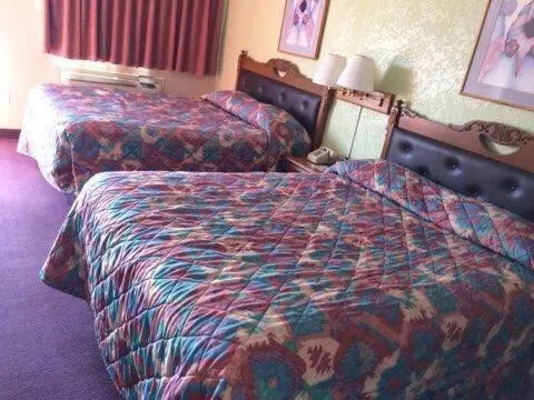 Bed in Western Motel
