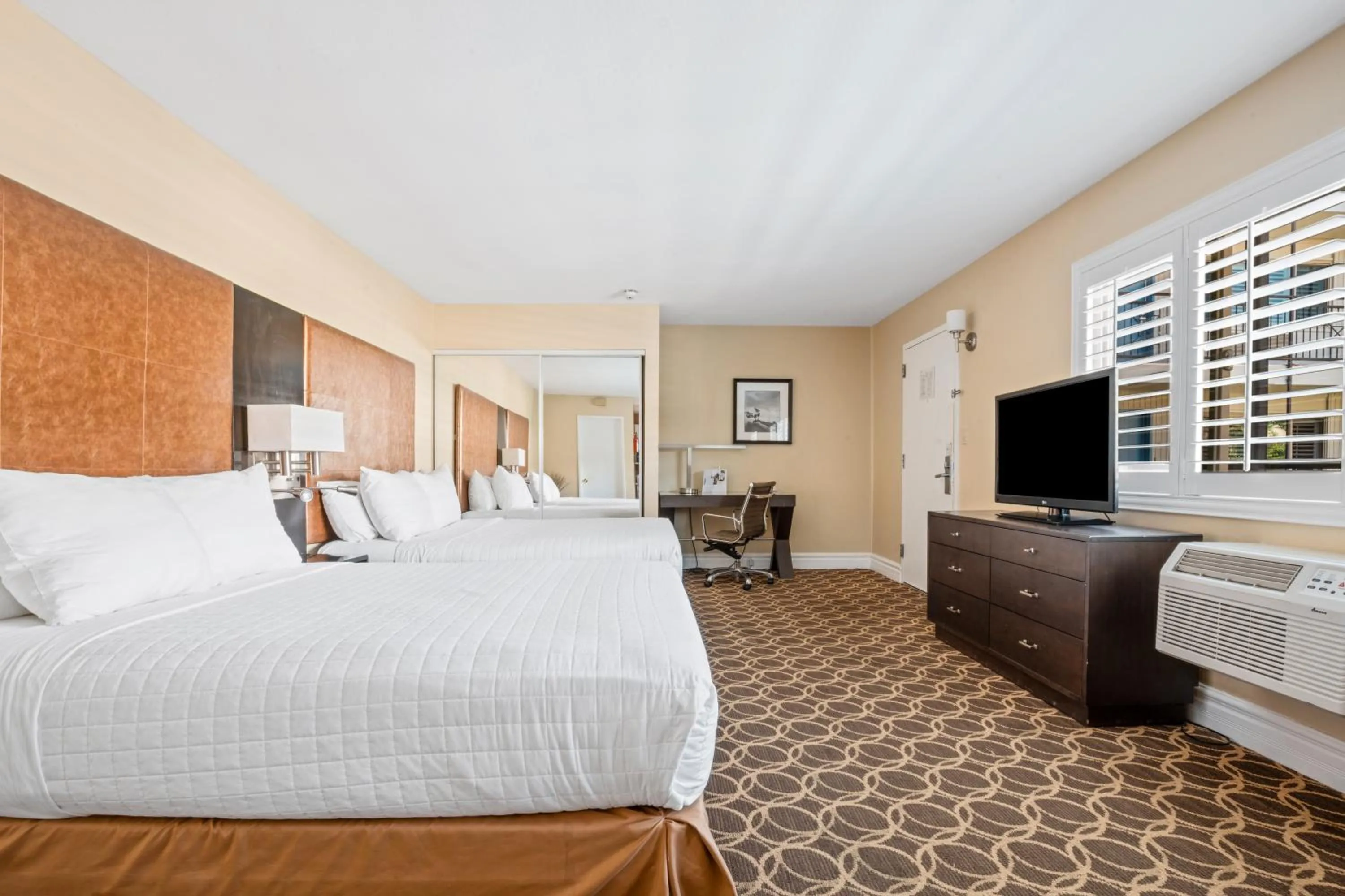 Bed in Marin Suites Hotel