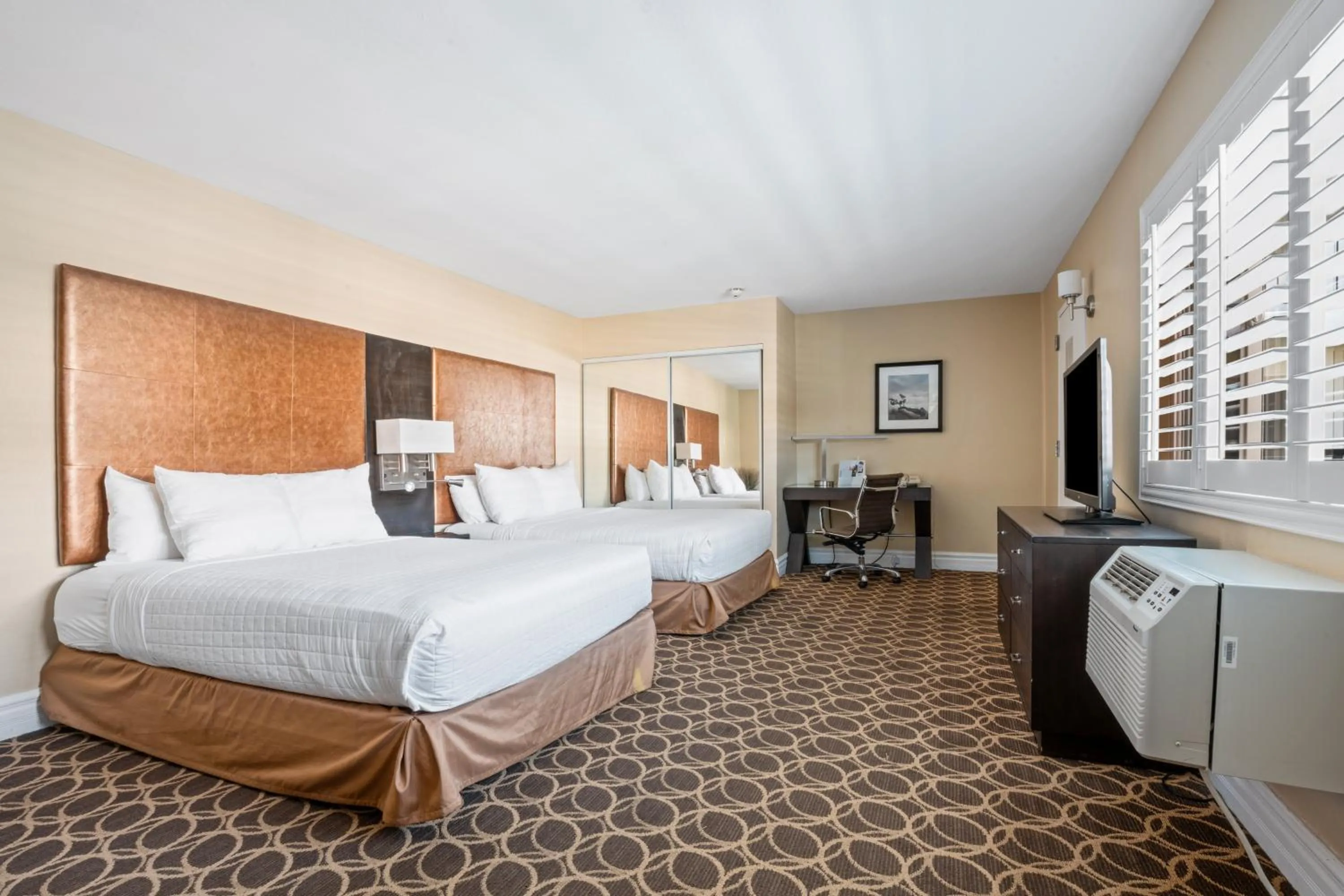 Bed in Marin Suites Hotel