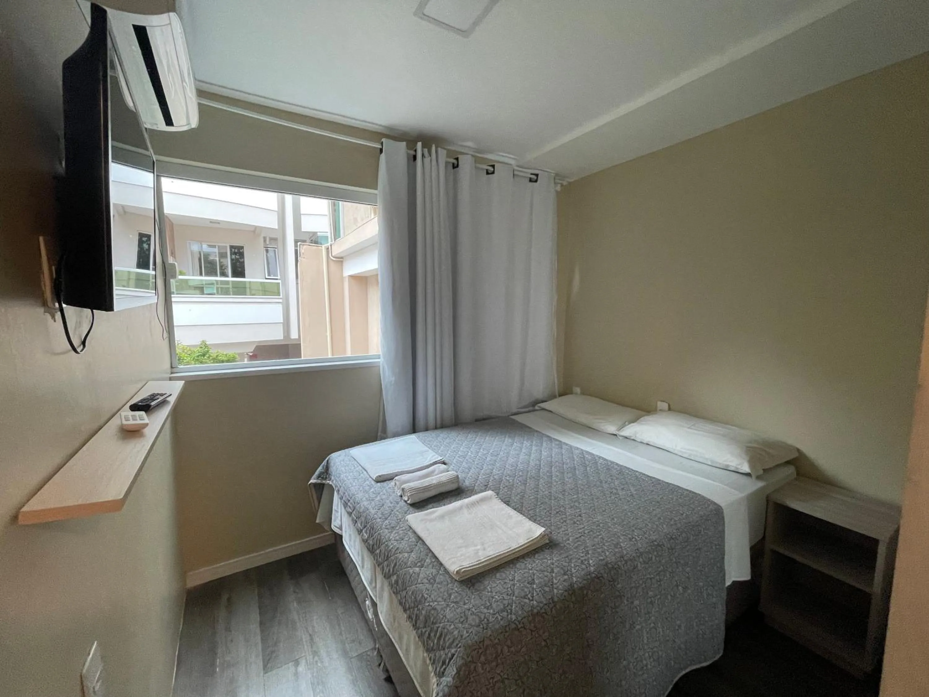 Bed in Pousada Tissiano