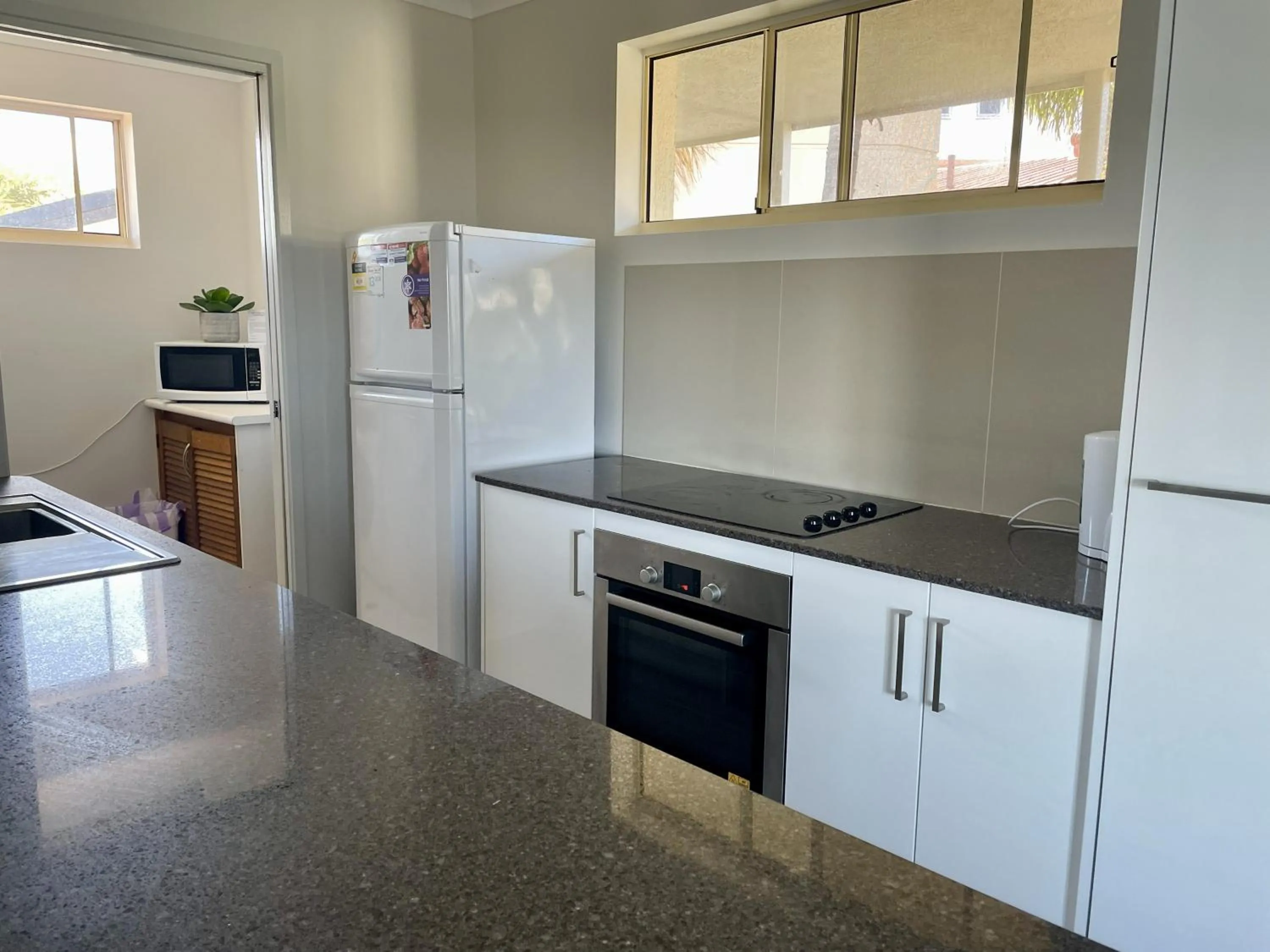 kitchen in Bayview Beach Holiday Apartments