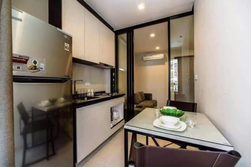 Kitchen or kitchenette in The Base Pattaya by Feng