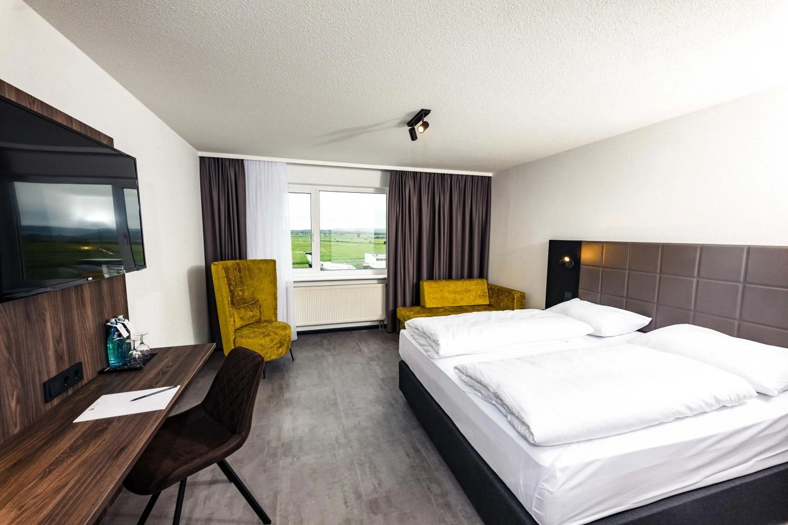 Photo of the whole room, Bed in Concorde Hotel am Flugplatz