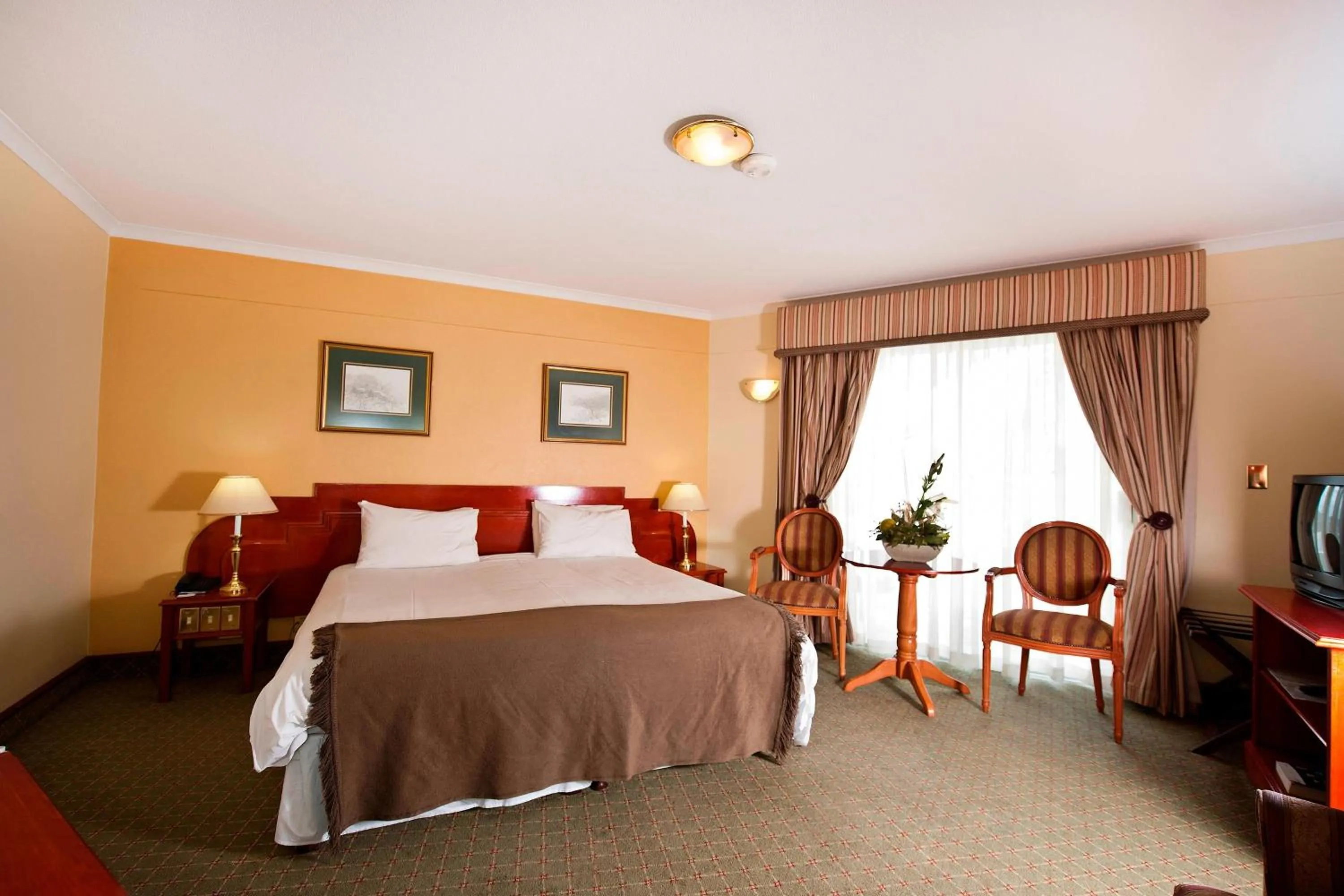 Photo of the whole room, Bed in Protea Hotel by Marriott Windhoek Furstenhof