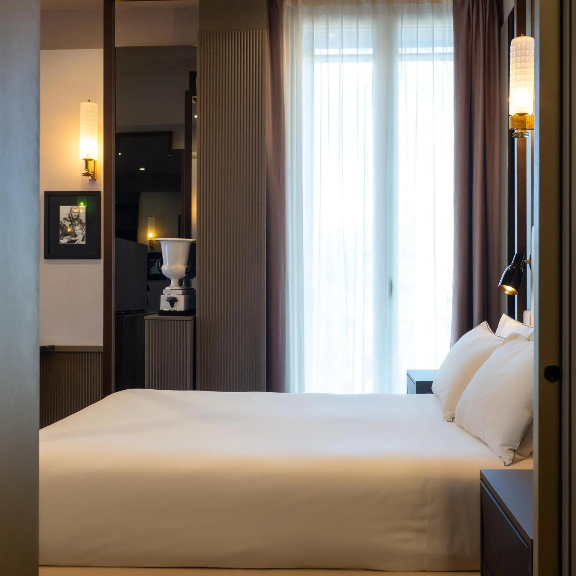 Bed in The Glam Boutique Hotel & Apt