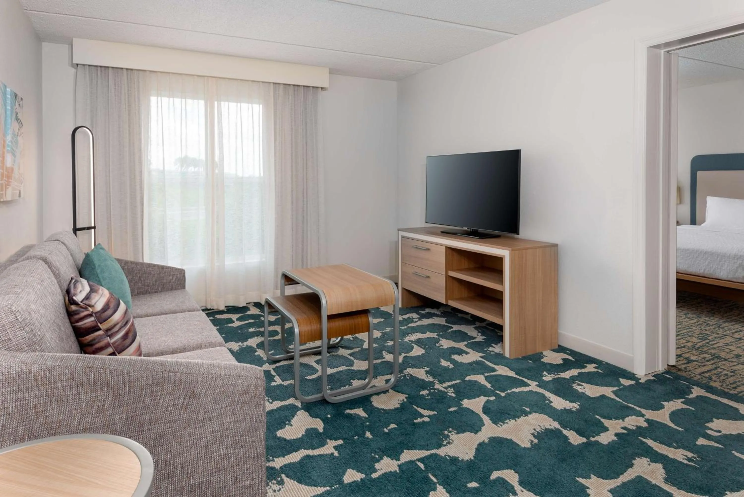 Living room, Bed in Homewood Suites by Hilton Orlando-Nearest to Universal Studios