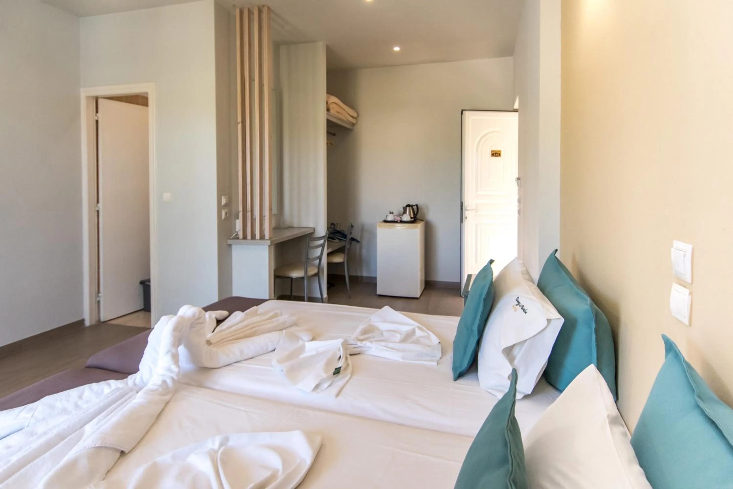 Bed in Sunny Garden Hotel