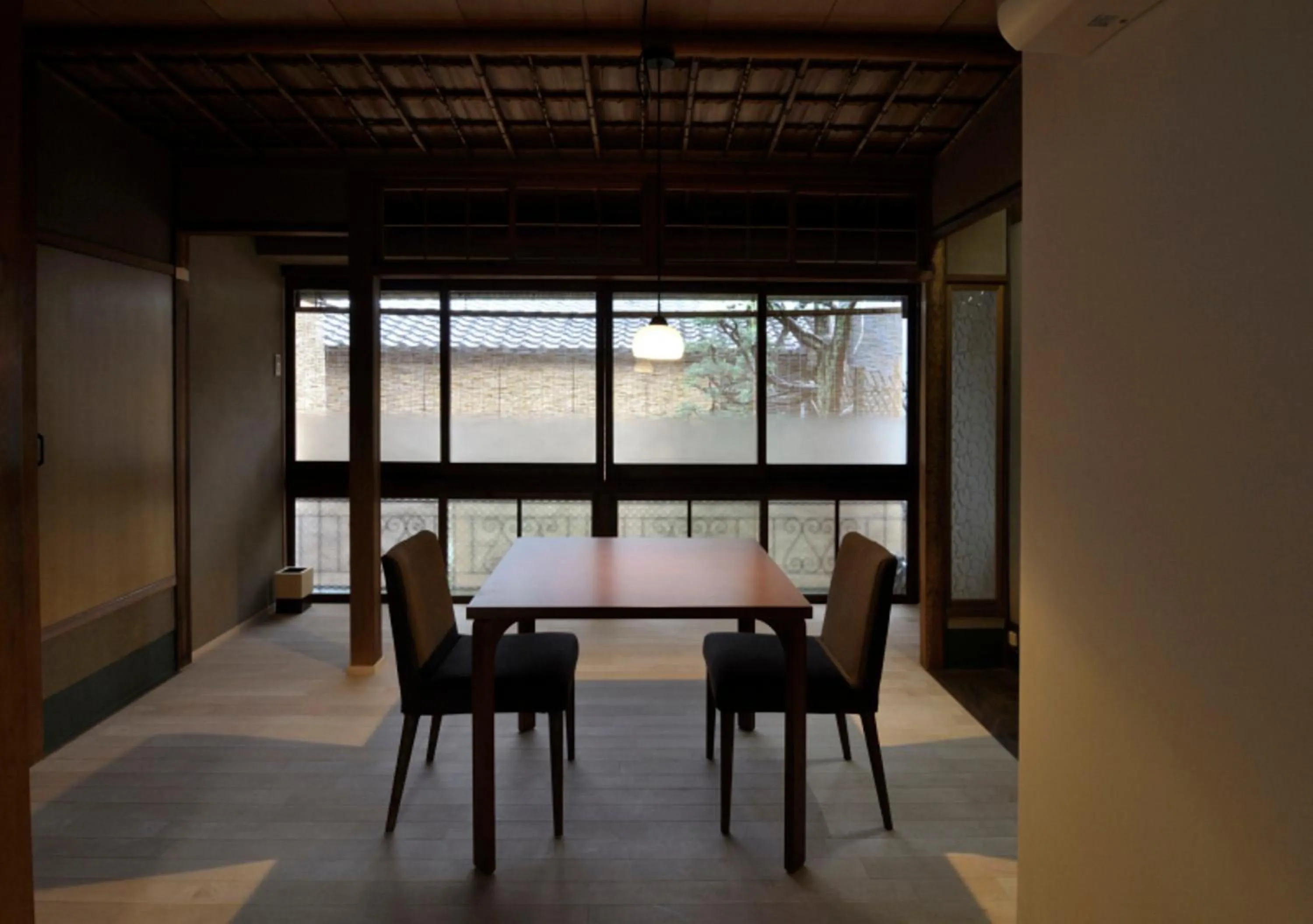 Dining area in IZUYASU Traditional Kyoto Inn serving Kyoto cuisine