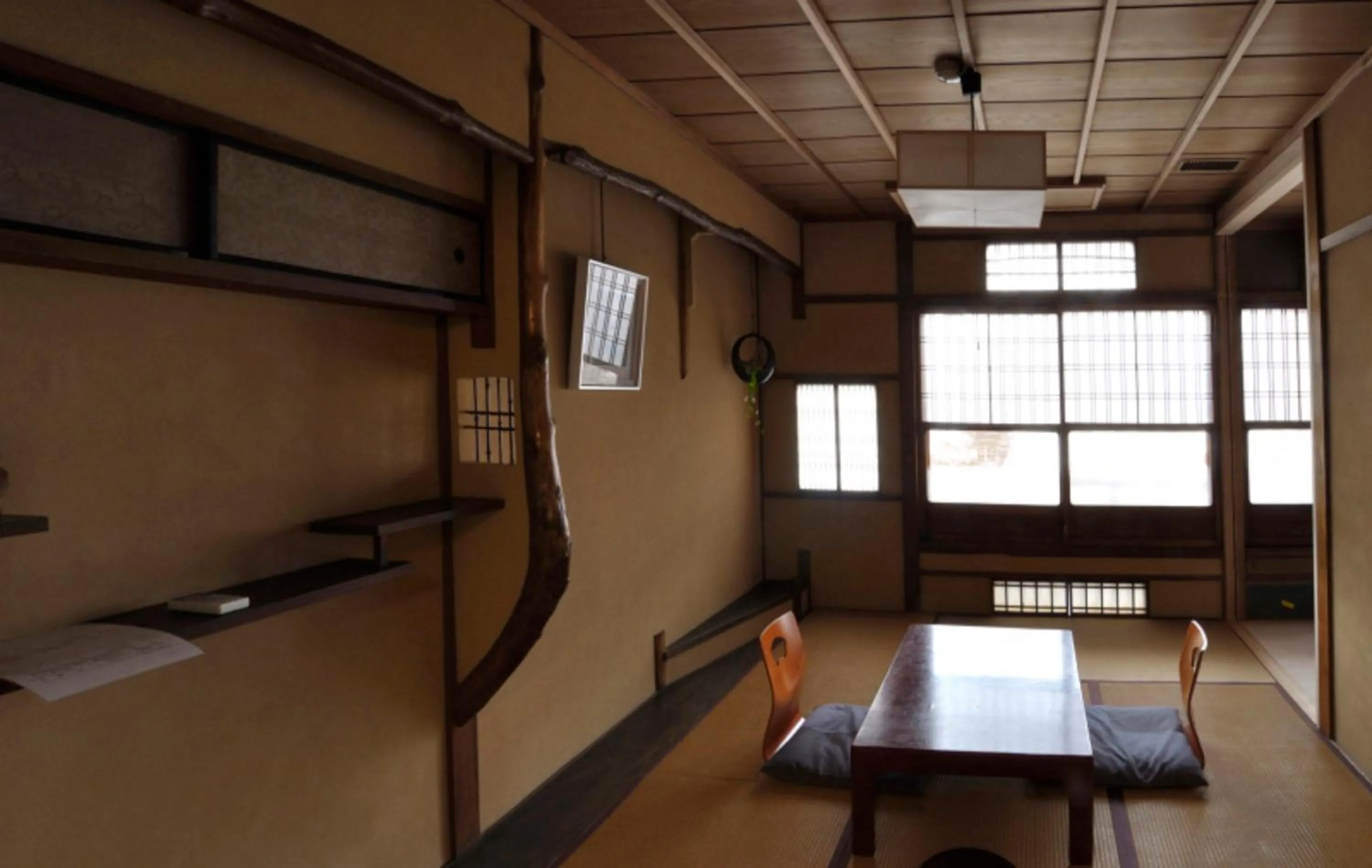 Seating area in IZUYASU Traditional Kyoto Inn serving Kyoto cuisine