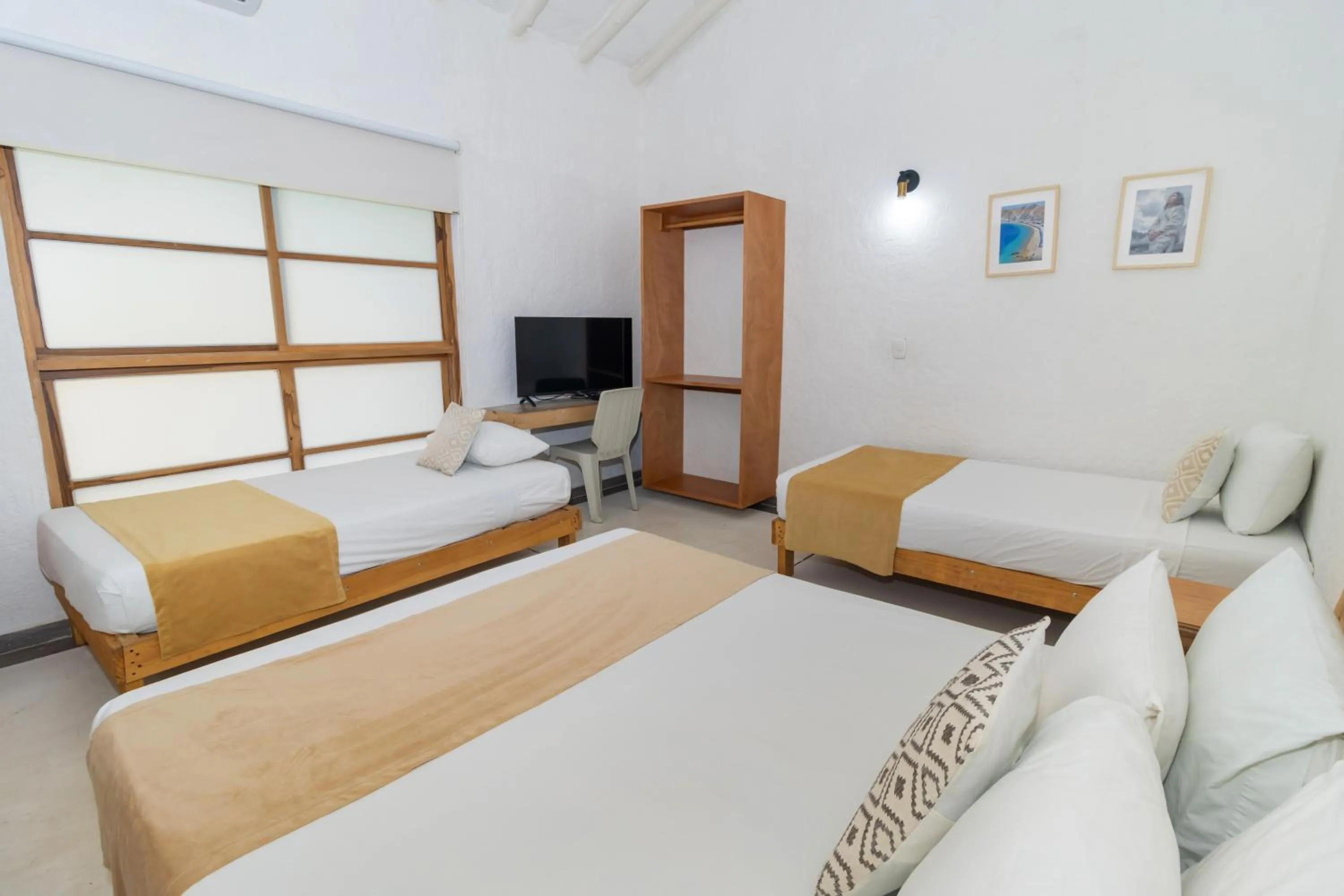 Bed in Hotel Sansiraka Suites By GEH Suites