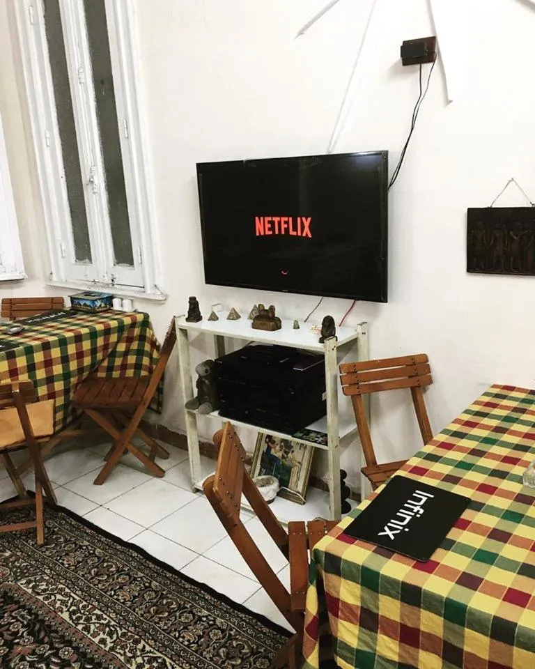 Communal lounge/ TV room in Transit Alexandria Hostel