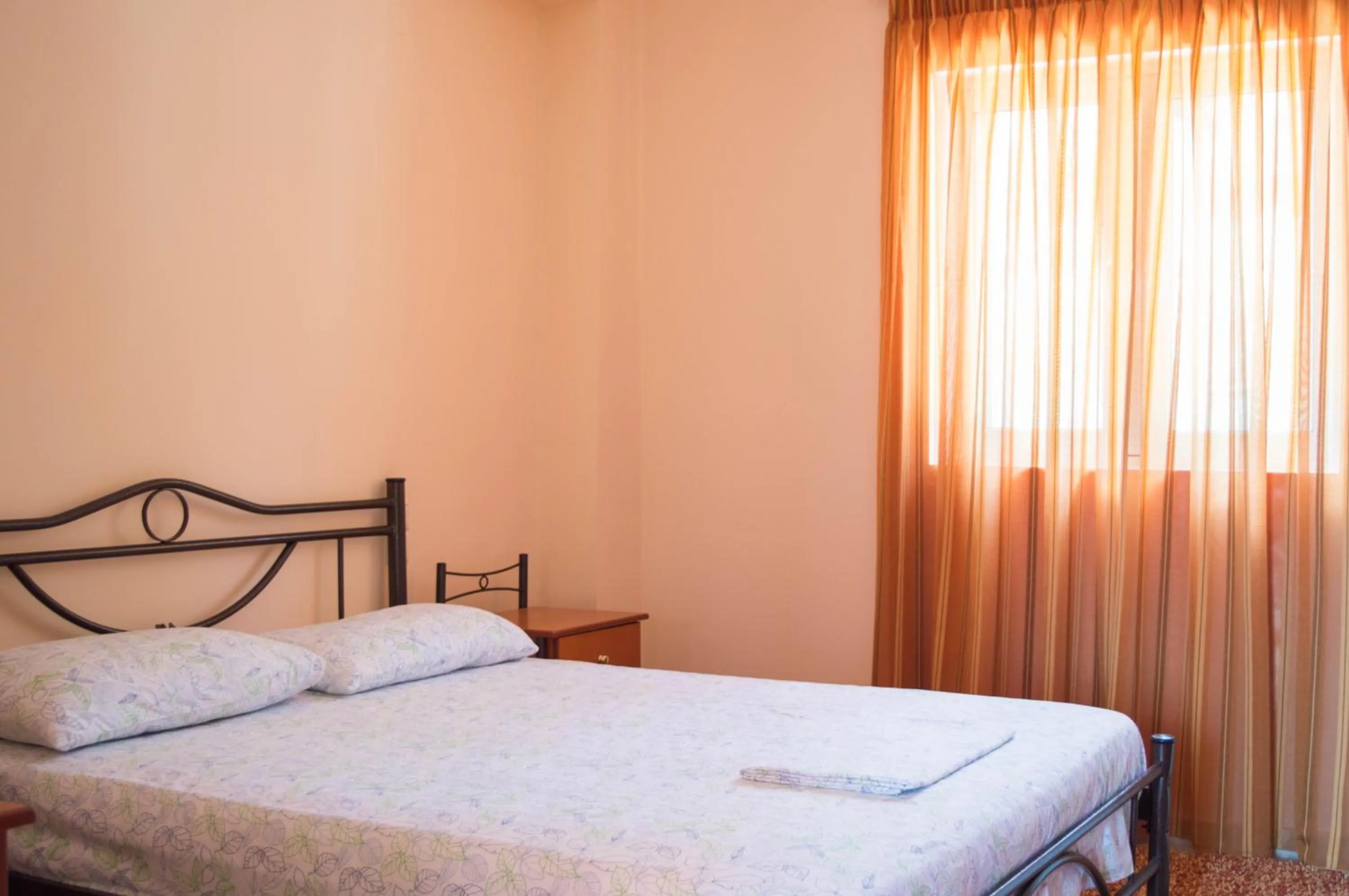 Bed in Manesi Apartments