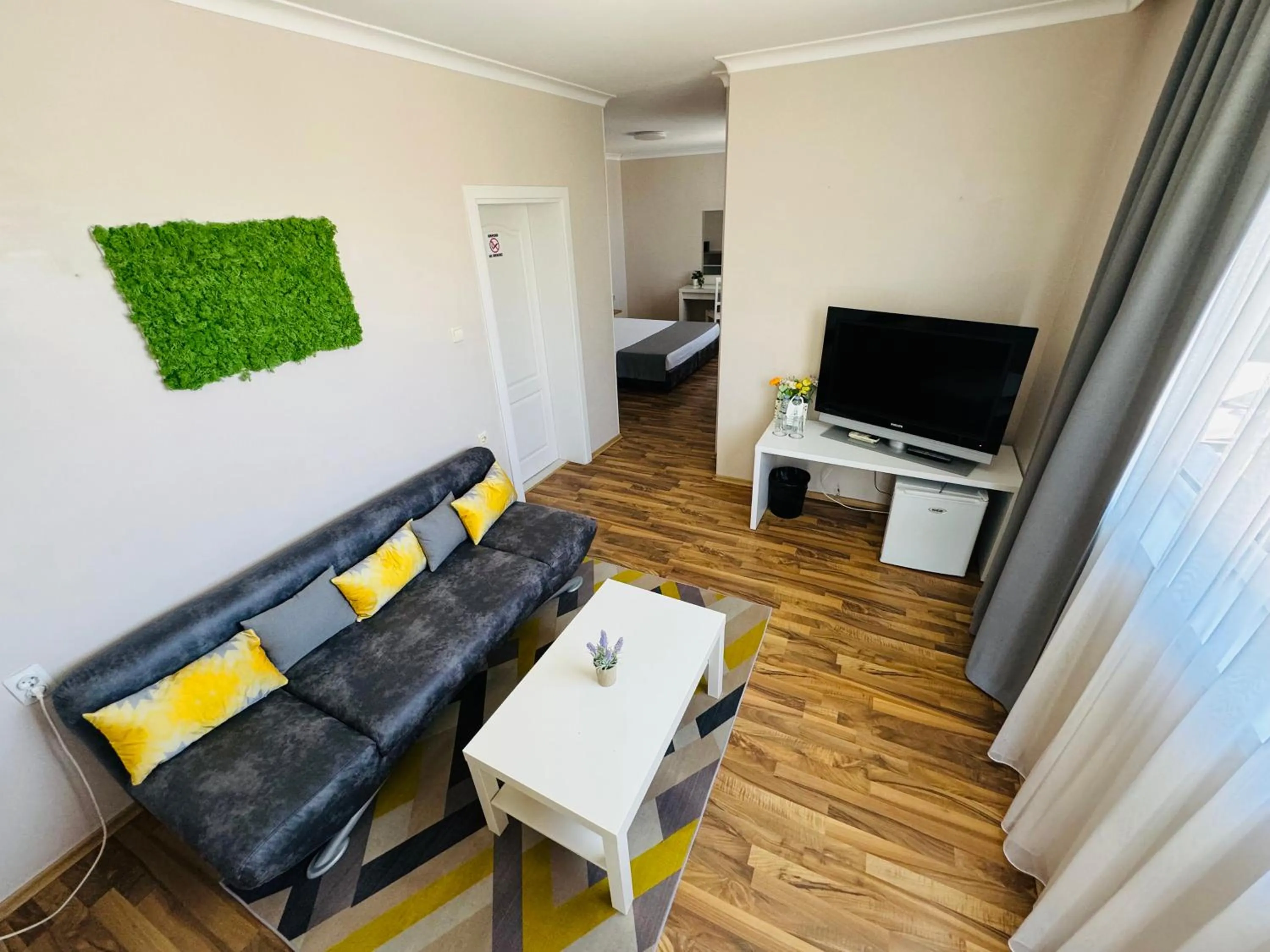 Communal lounge/ TV room in Hotel Amfora