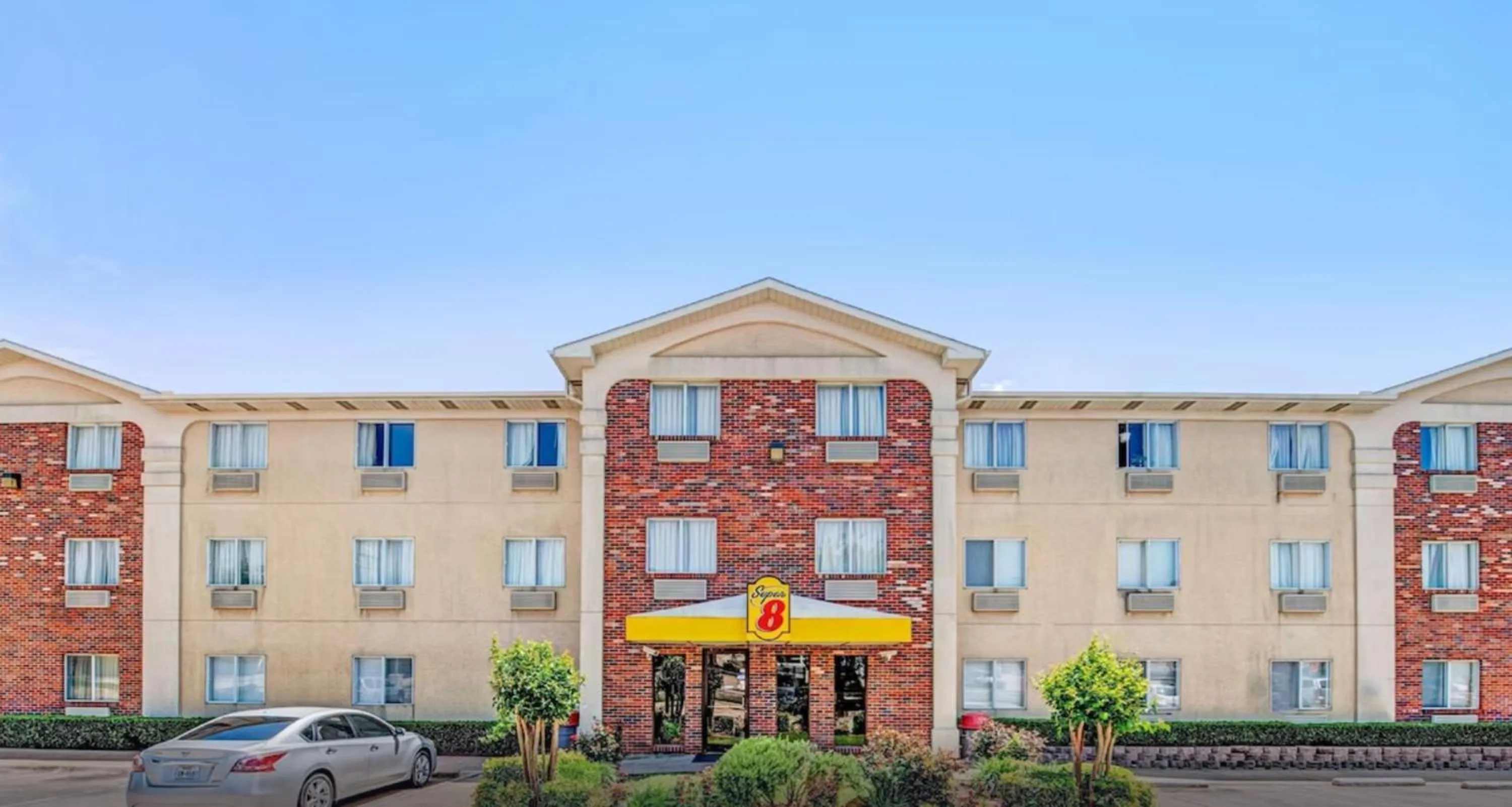 Property building in Super 8 by Wyndham McKinney/Plano Area