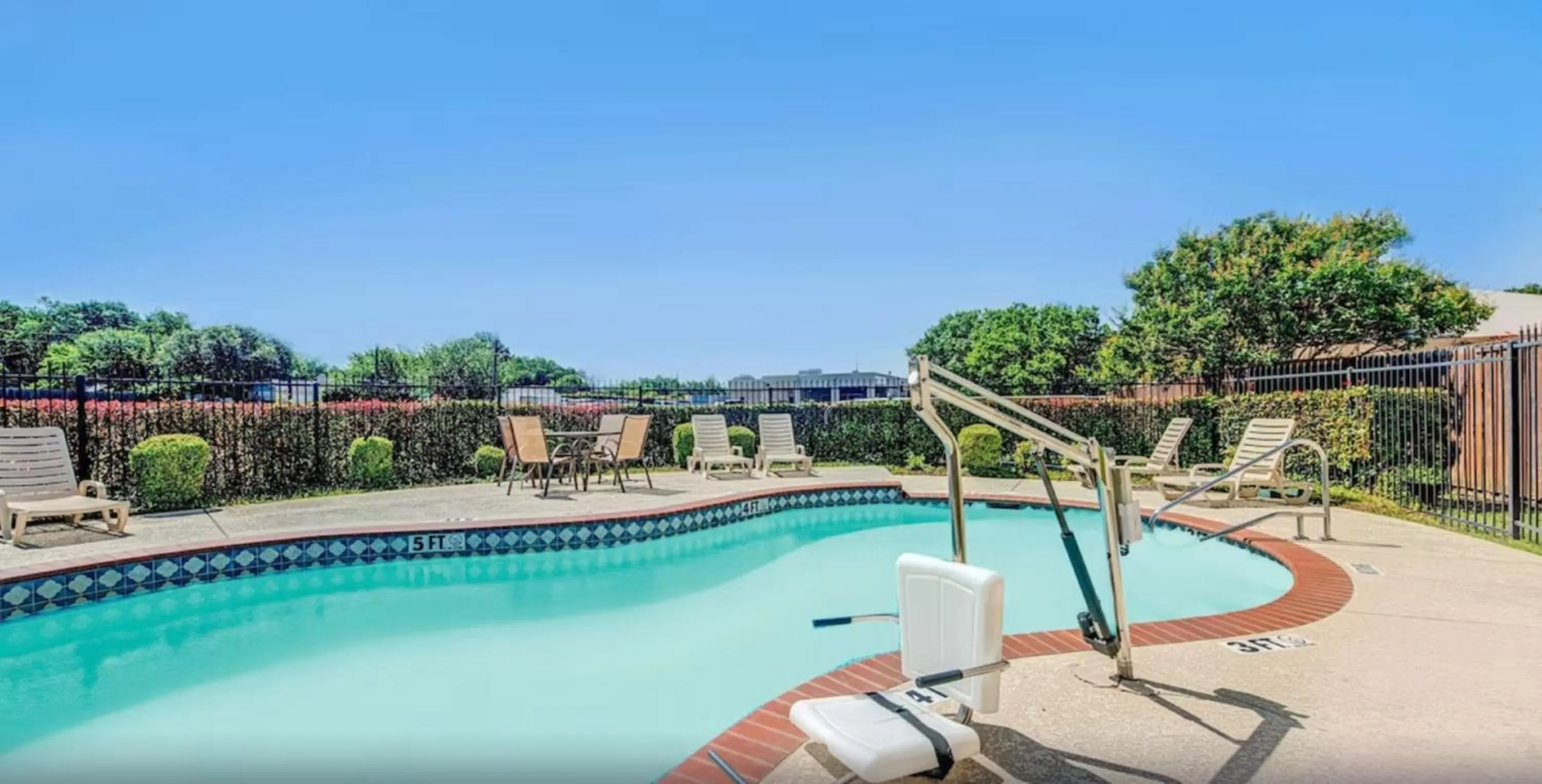 Pool view in Super 8 by Wyndham McKinney/Plano Area